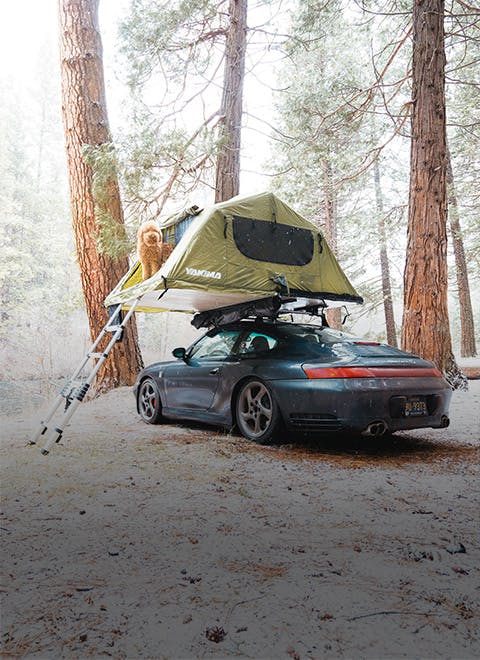 A Porsche 911 with a roof-top tent: a classic Porsche adventure
