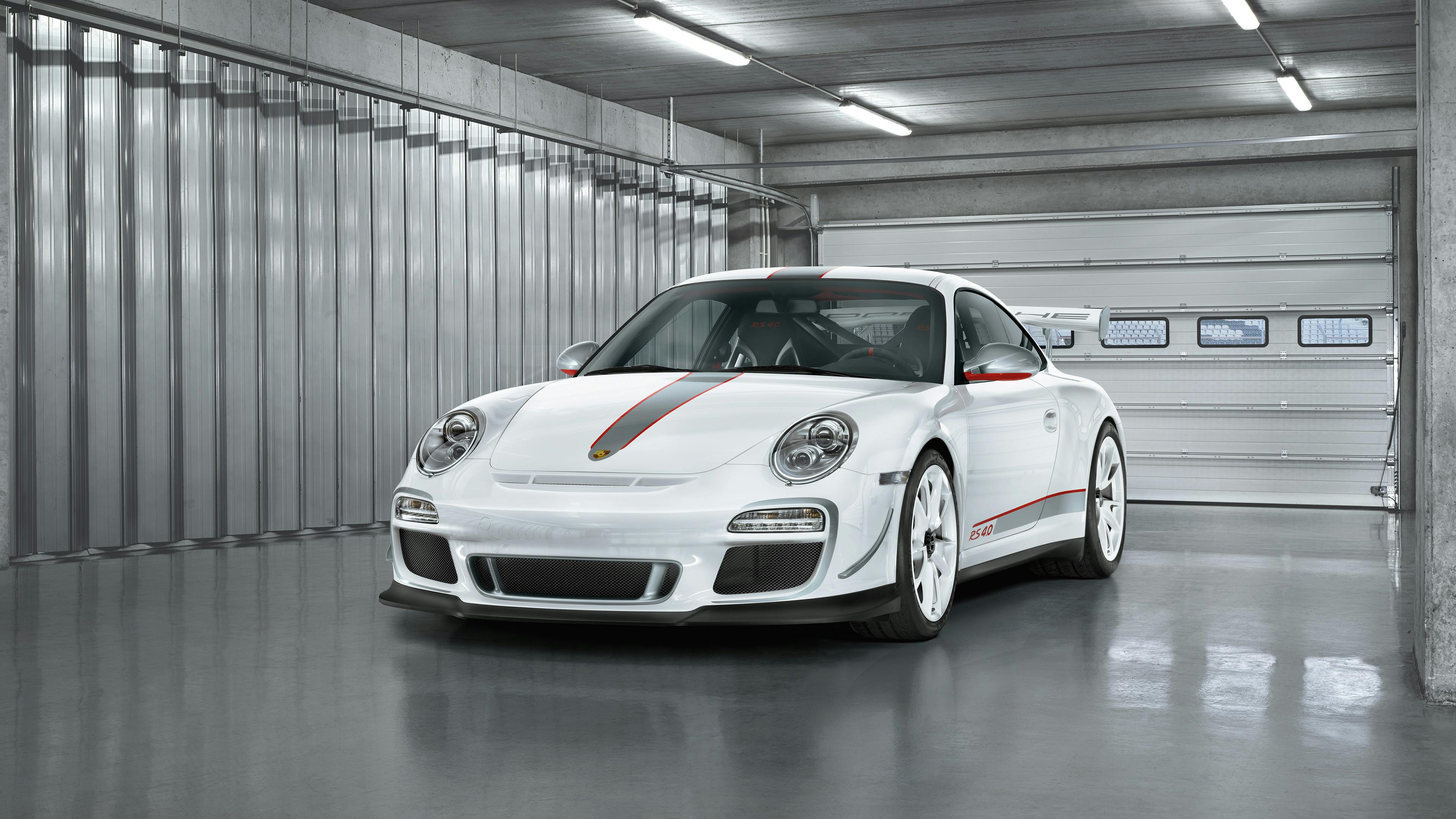 Parked white 911 GT3 RS 4.0 type 997 in the pit lane.
