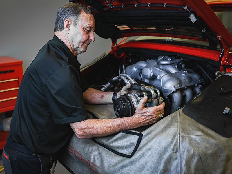 Mechanic checking an engine.