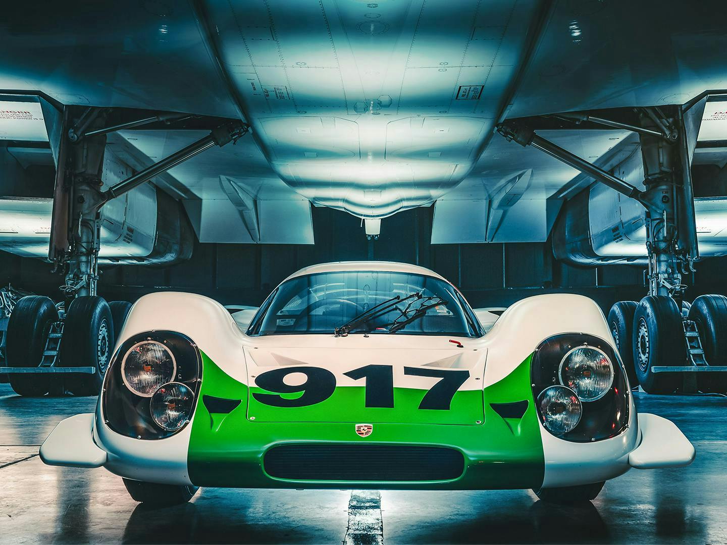 A Porsche 917 is positioned at the center of the frame.