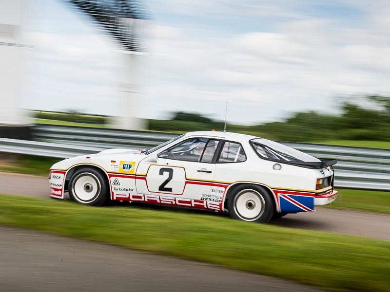Fully restored Porsche 924 GTP driving on the race track.