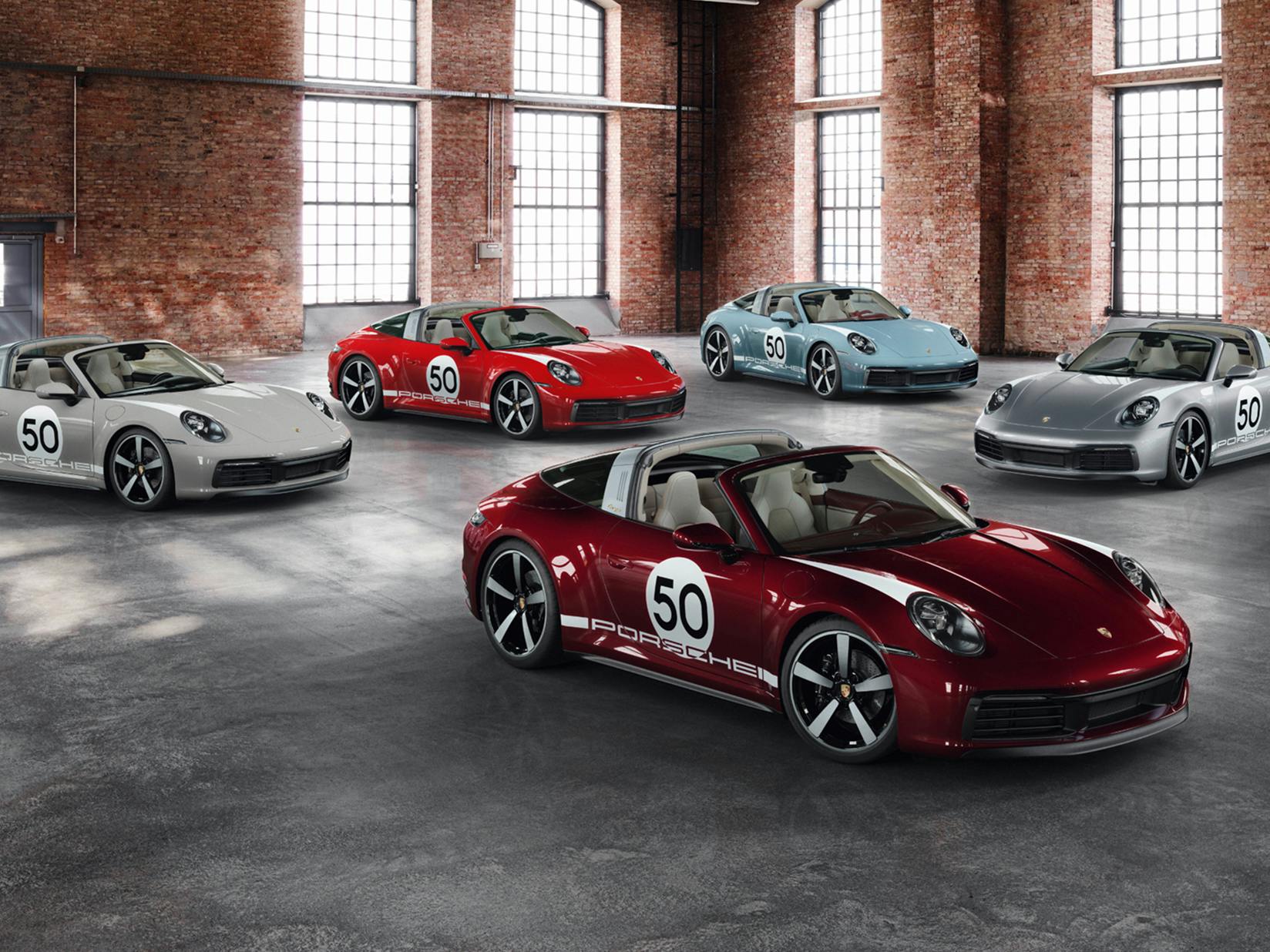 Various Porsche models in a warehouse.