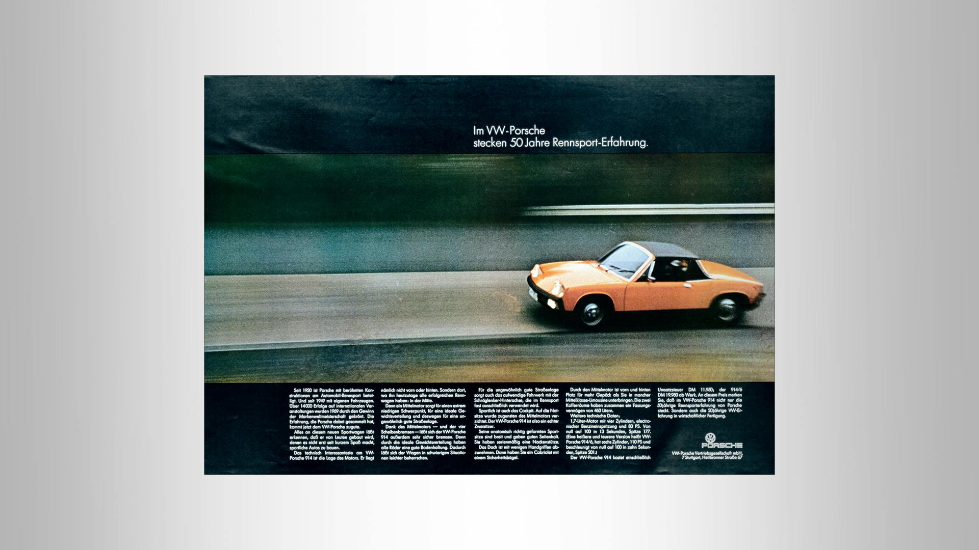 Advertsing poster VW Porsche: A historic VW Porsche drives down the street.