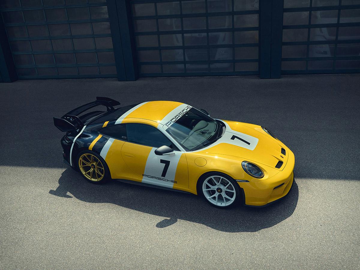 A 911 GT3 Le Mans in individual painting in Summer Yellow, Black and White from above.