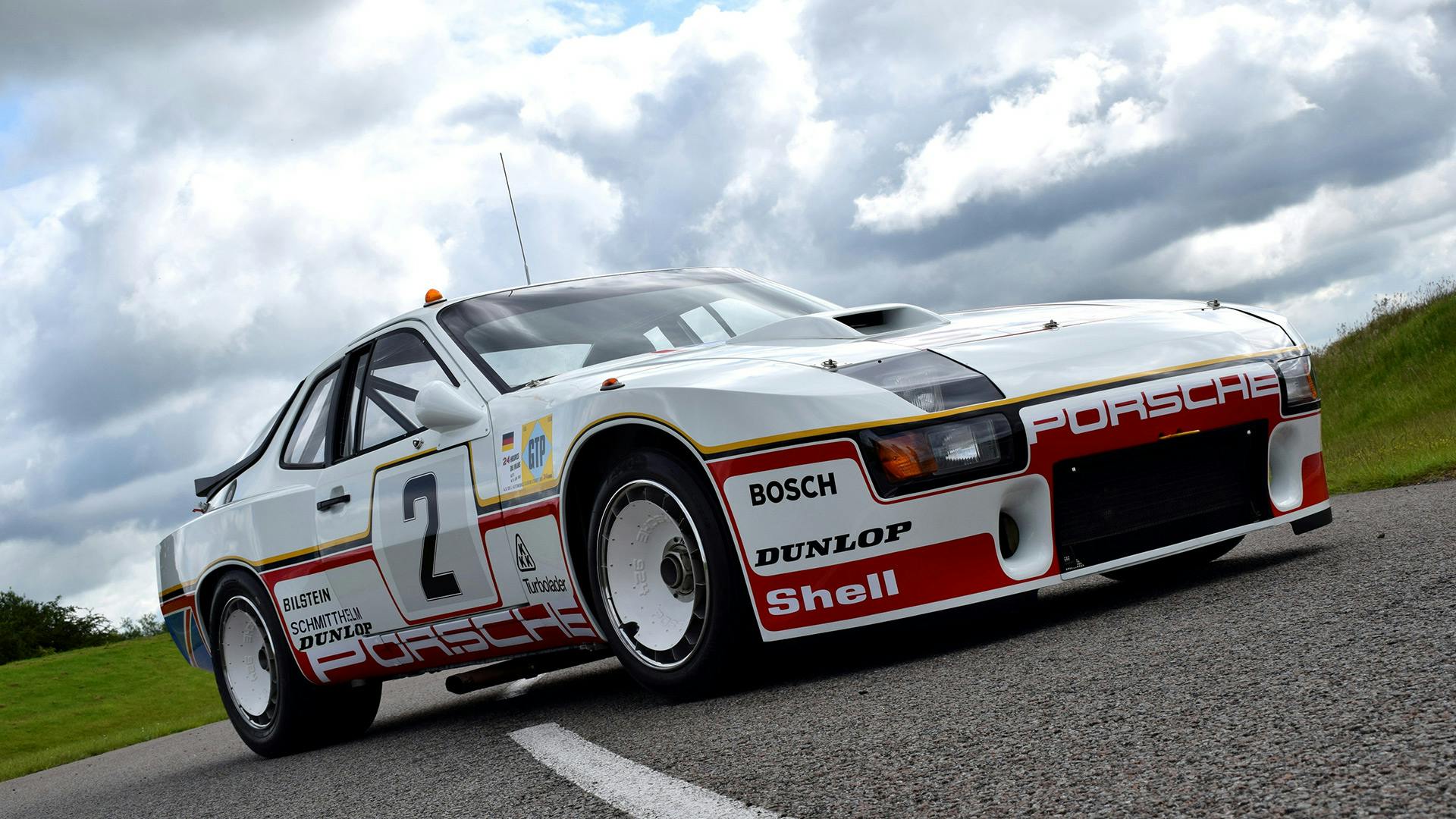 Fully restored Porsche 924 GTP standing on the race track.