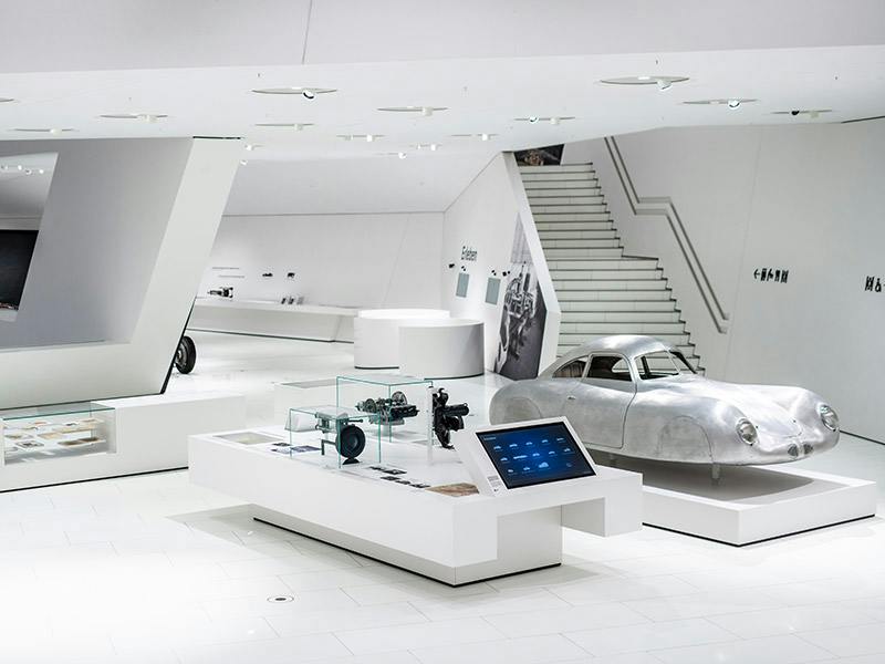 Widely spaced white room with interactive touch point and vehicle body