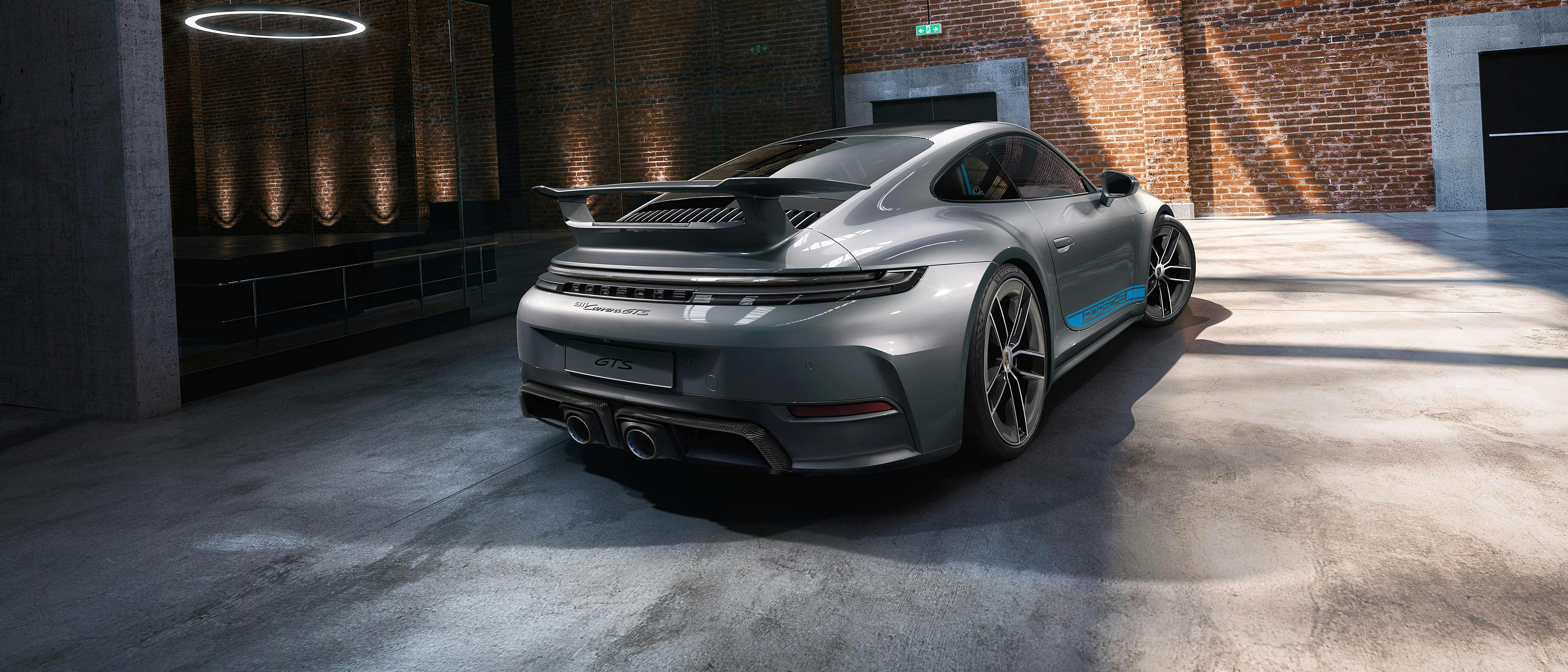 Porsche Exclusive Manufaktur 911 Carrera GTS in a warehouse.