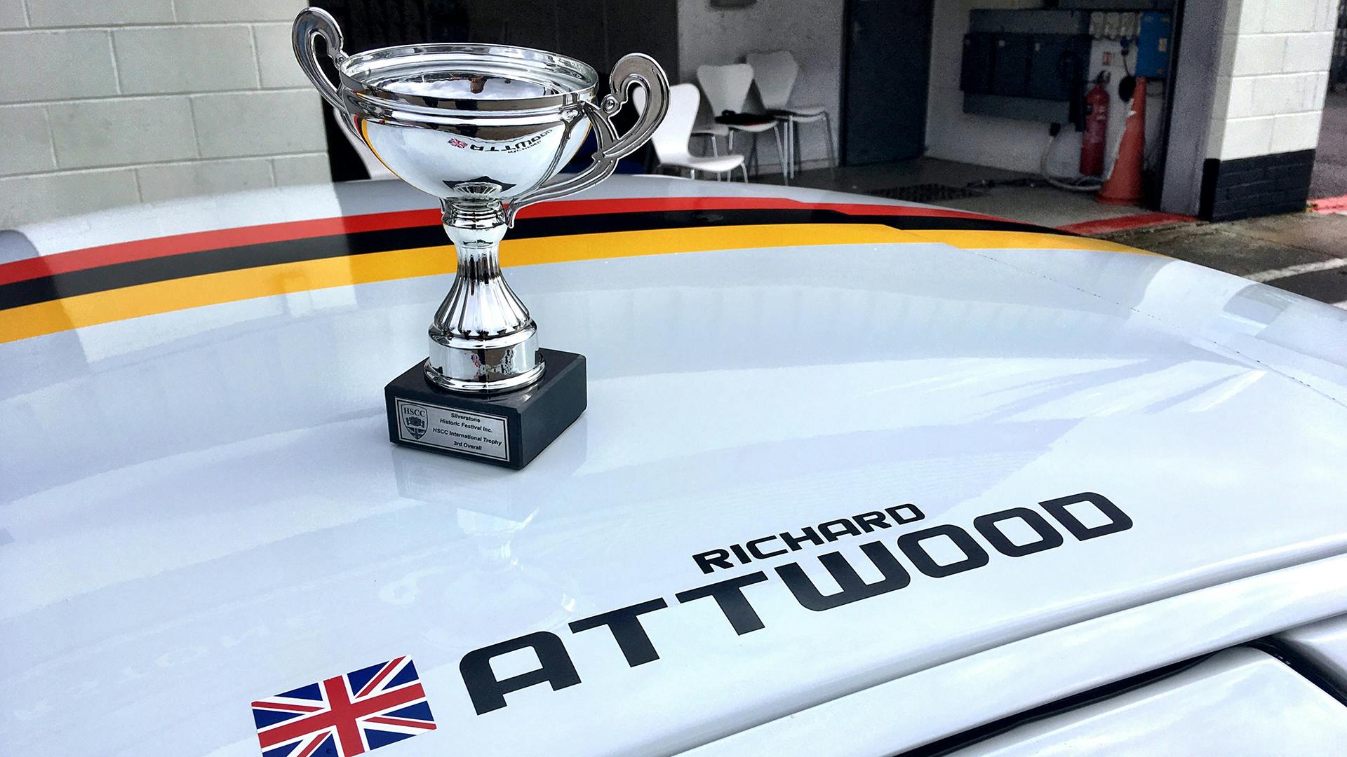 The Silverstone Finals trophy standing on the roof of the Porsche 928.