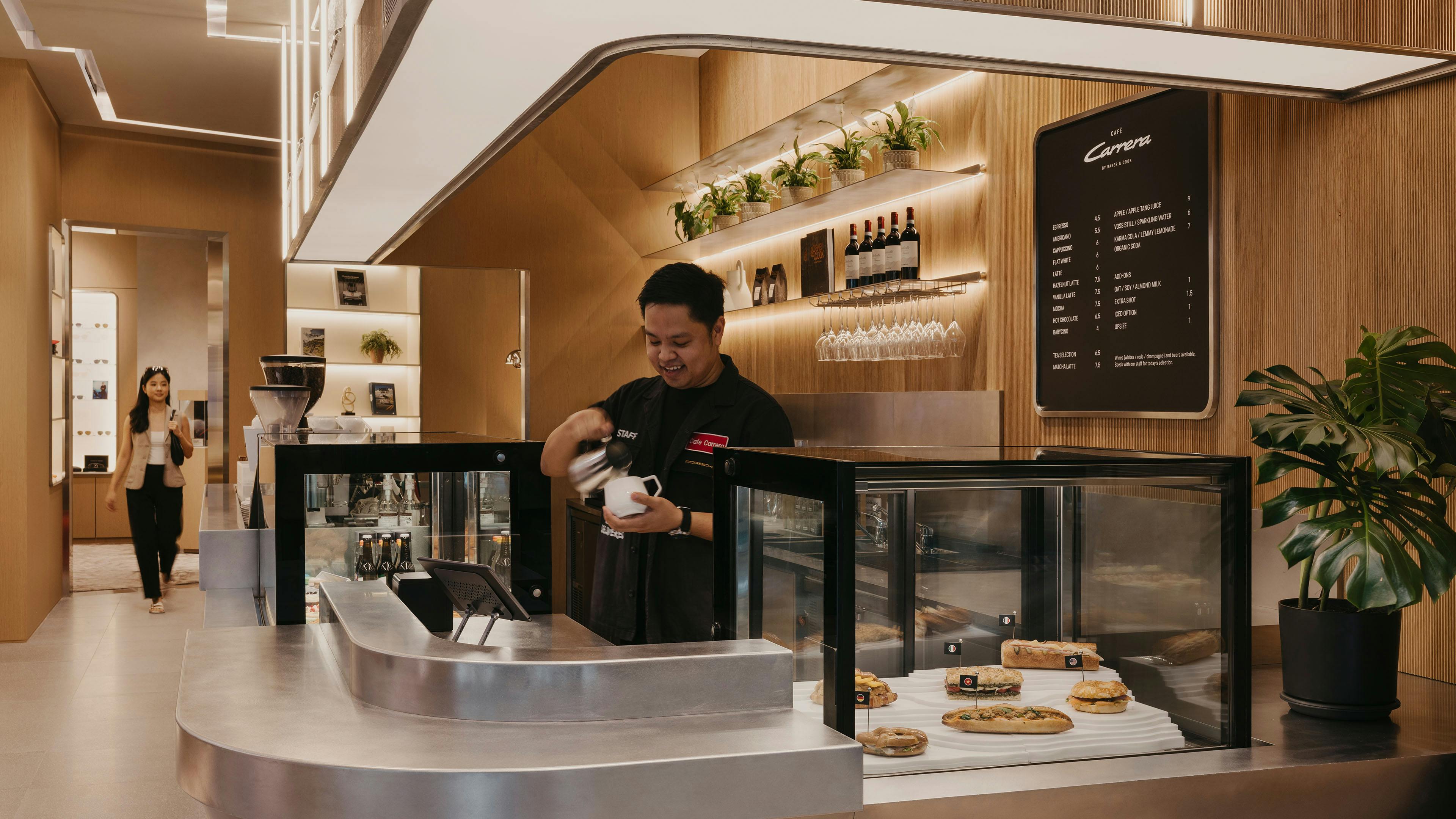 Cookies and pastries displayed in glass cases at Café Carrera Porsche at Jewel Changi.