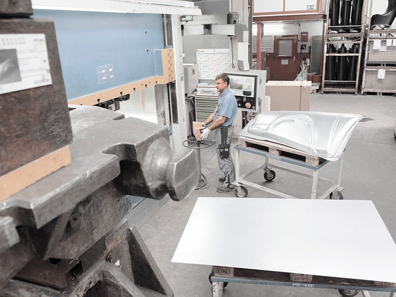 Workshop scene: piece of sheet metal, machines