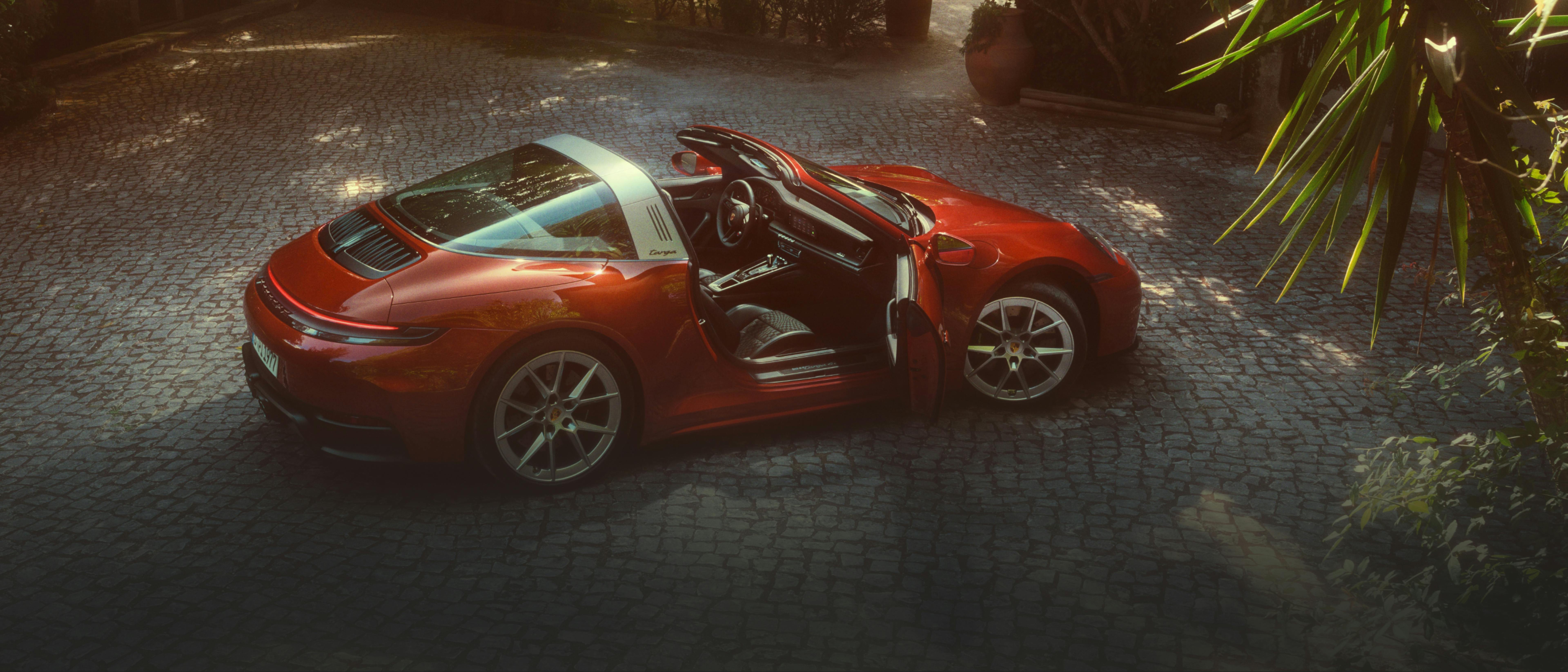 Porsche 911 Targa with Heritage Design Package Pasha. Side view of the vehicle with passenger door open.