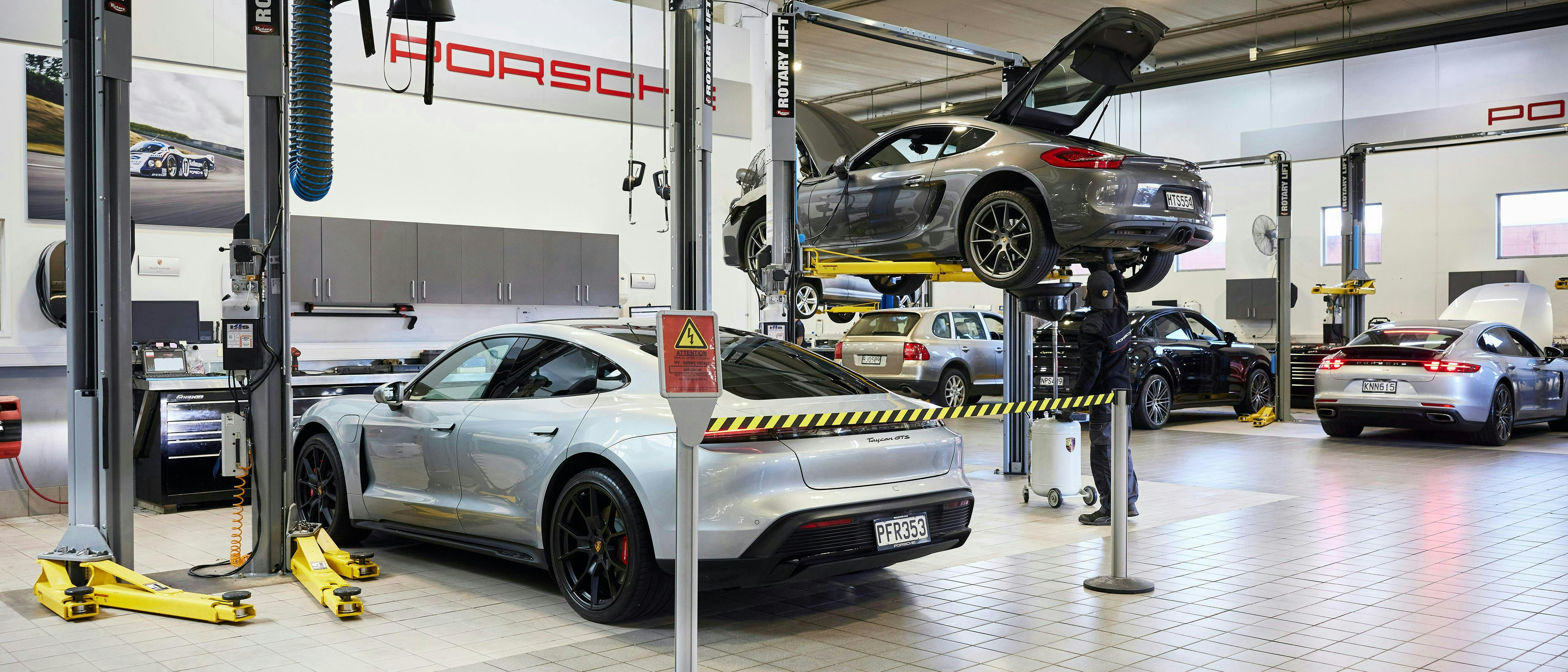 Porsche vehicles in workshop