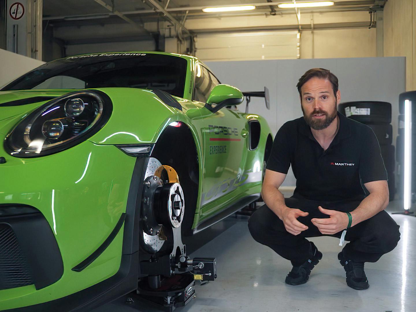 A Porsche expert posing with the car.