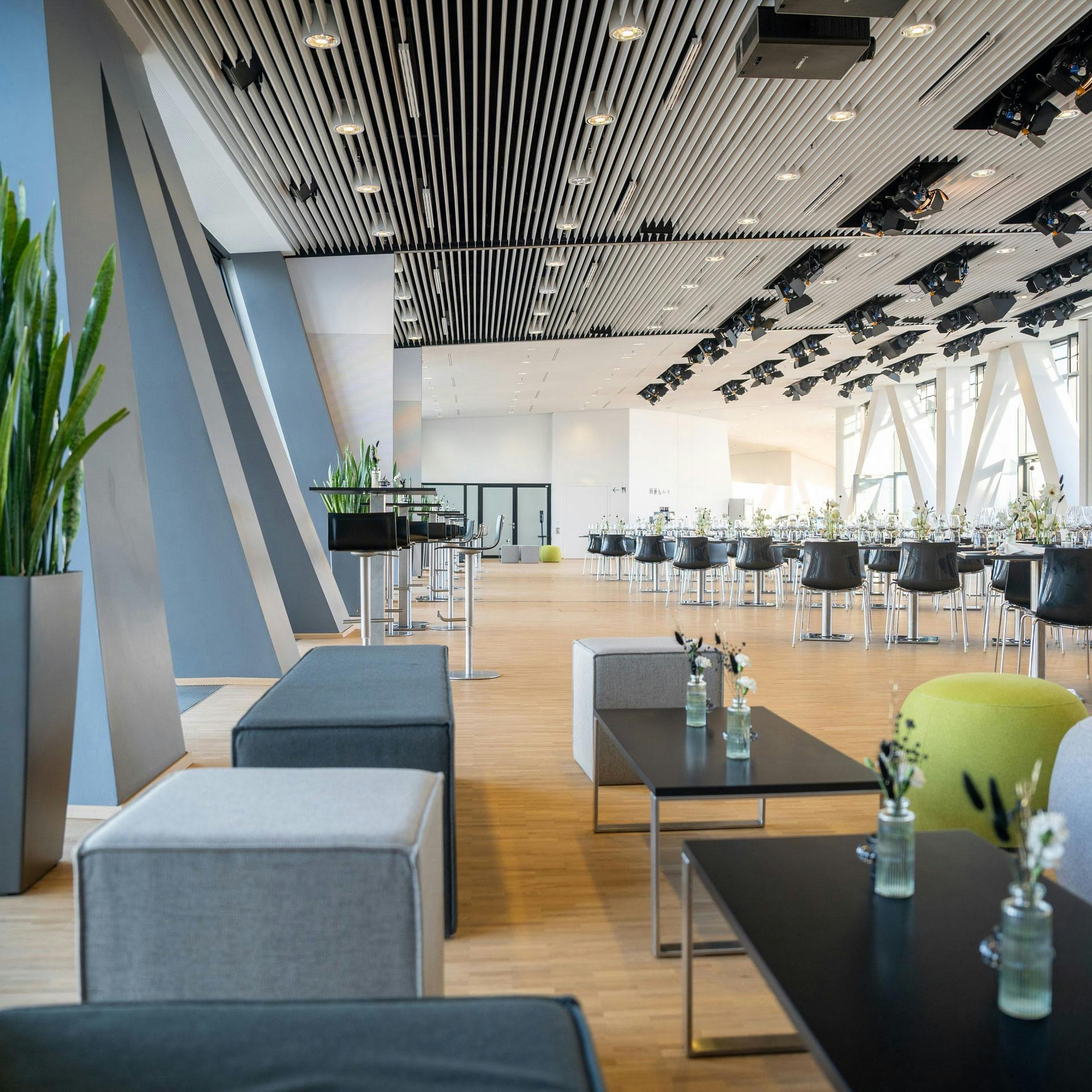 View of the event location, which is furnished with a mixed setting for an event.