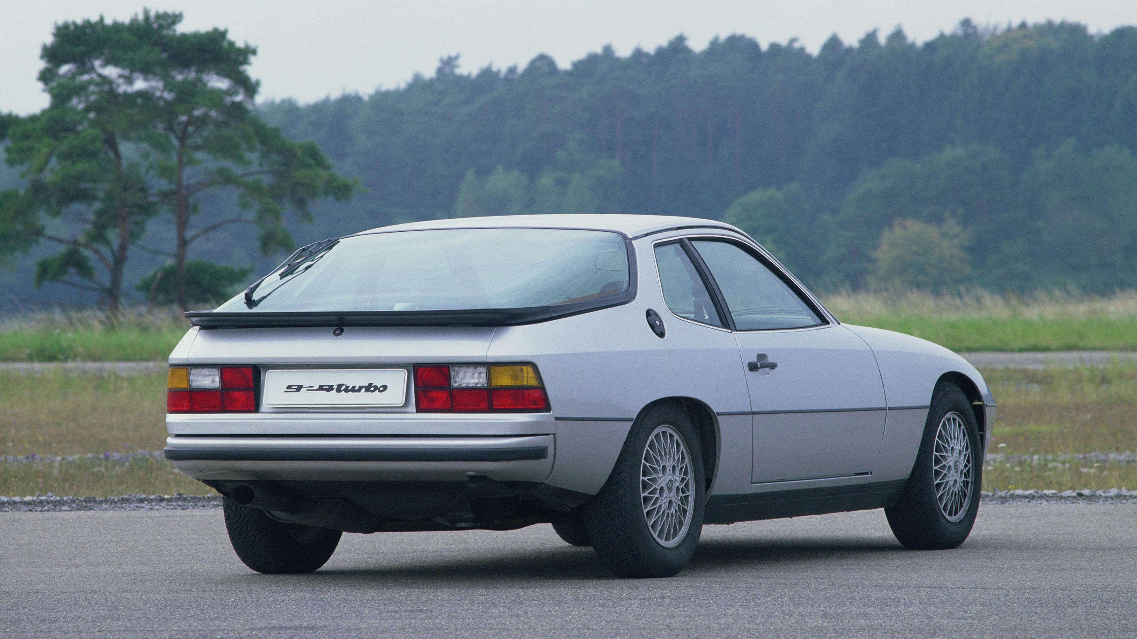 White Porsche 924 Turbo (931) driving on a country road.