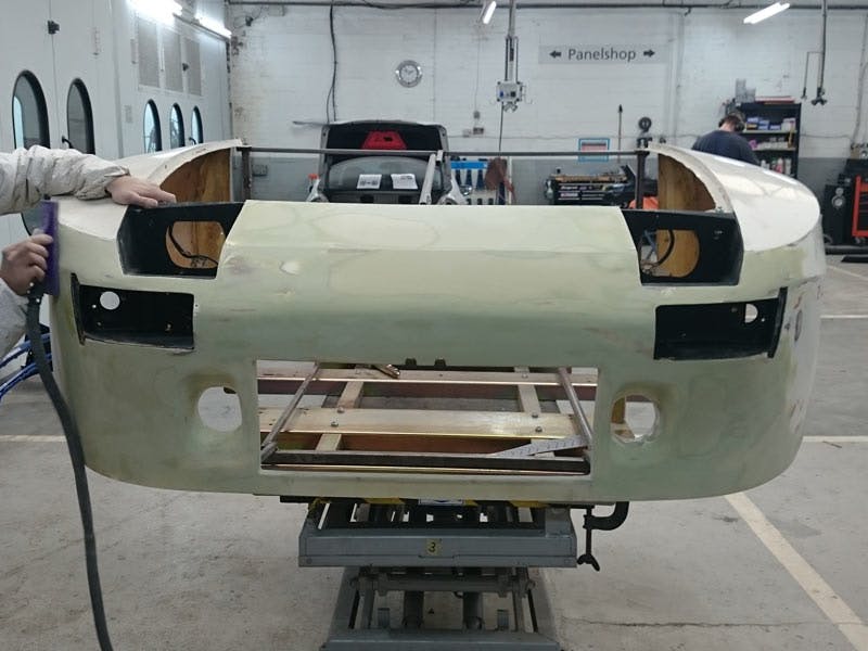 Employee working on a new mould for the front, replicating the original nose.