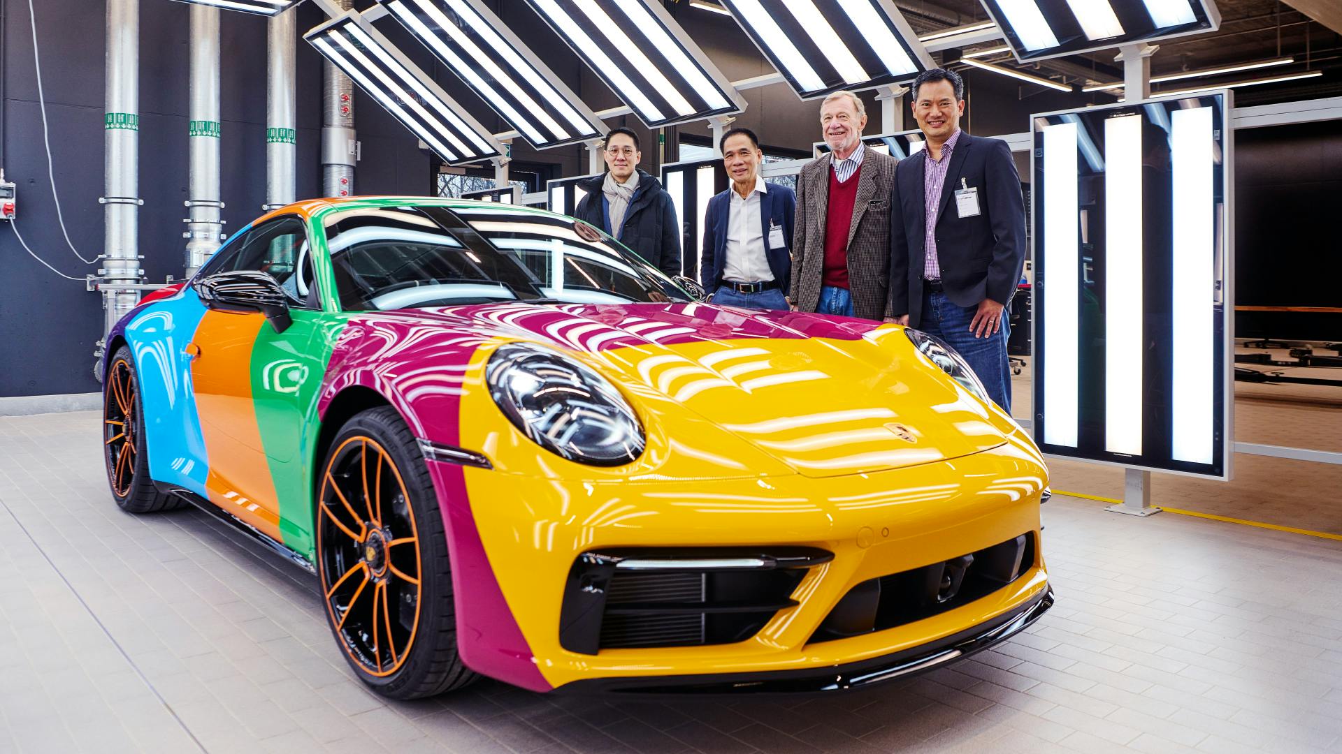 Dreams in Colours: Sideview of 911 model painted in bars with all seven colours of the 30 Years Porsche Thailand Edition.