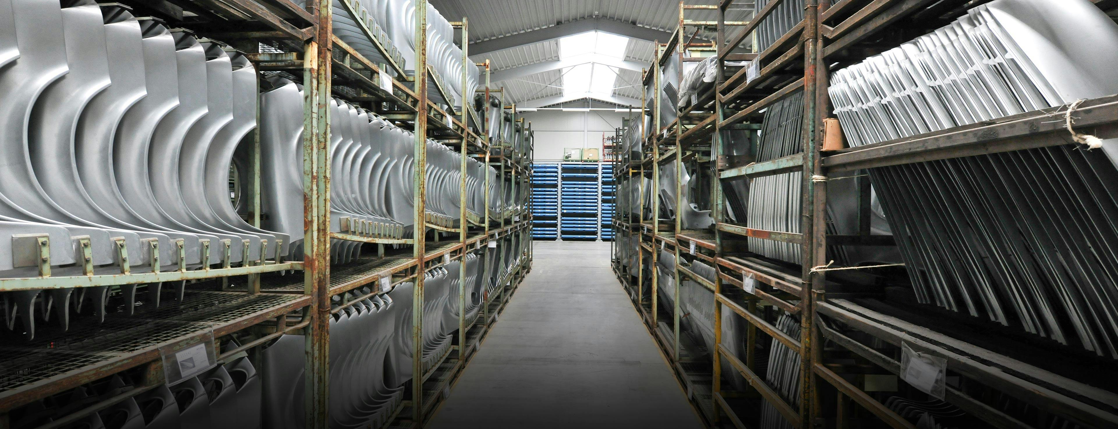 Bodyshell parts and lightweight parts in a warehouse.