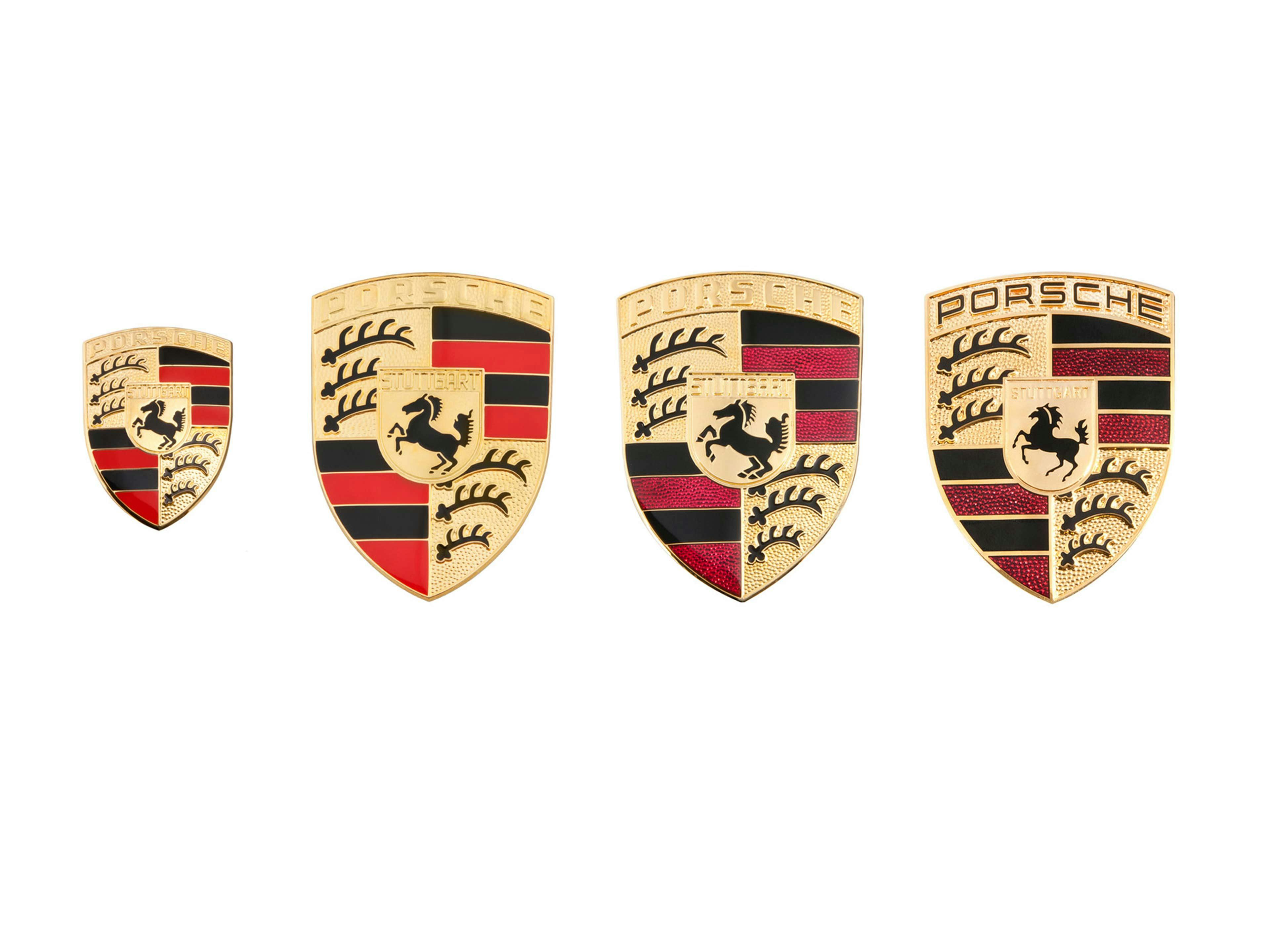 Four images of different Porsche Crests.