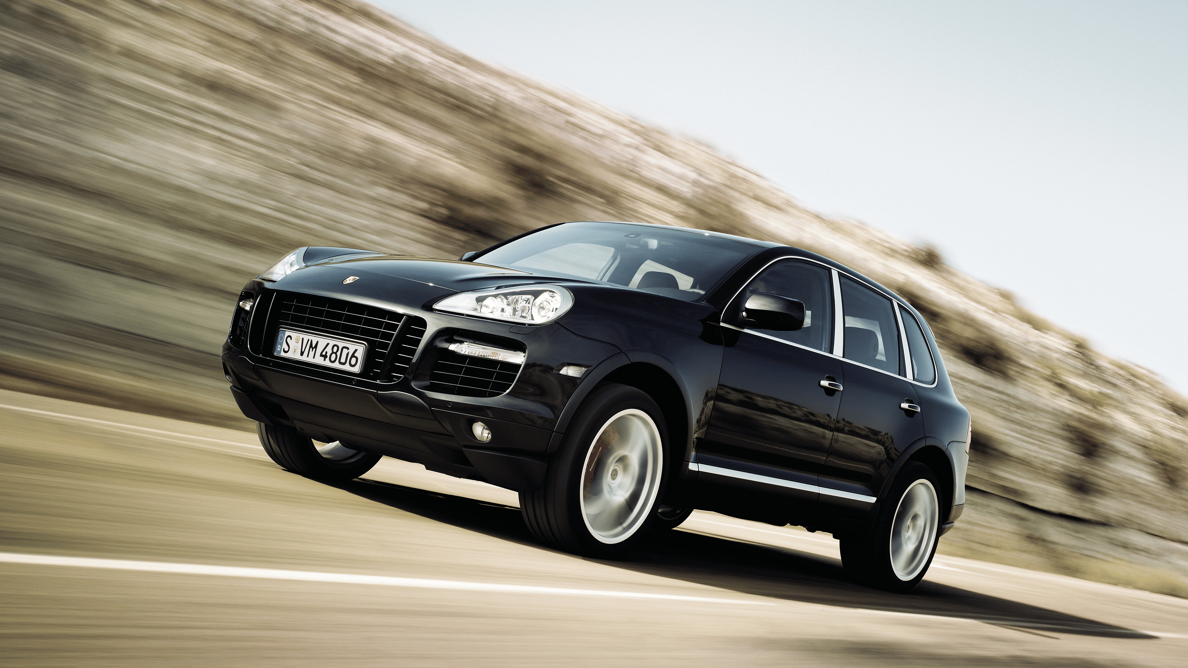 Black Porsche Cayenne Turbo 2008 driving