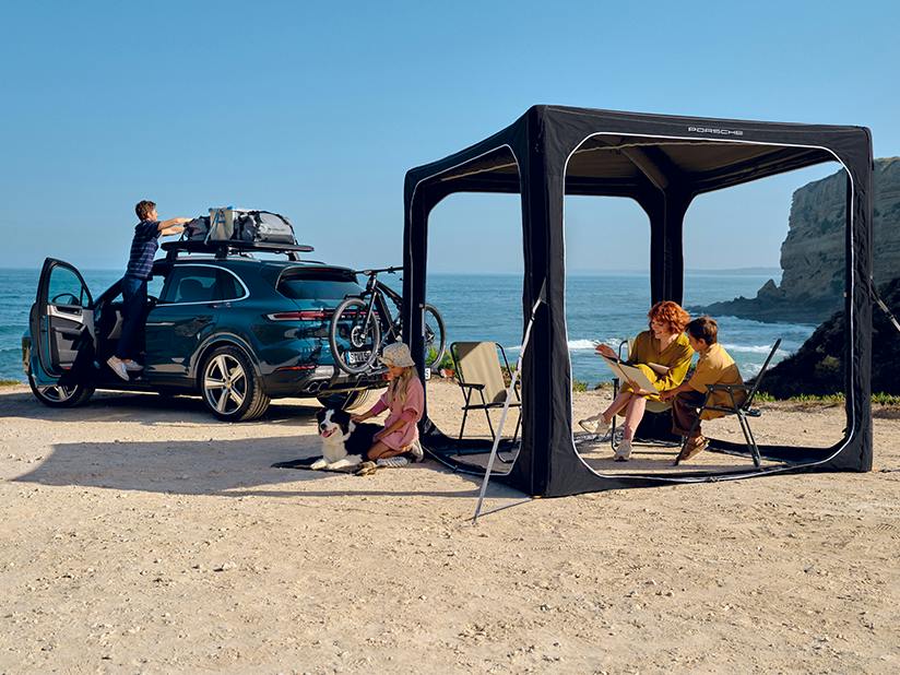 Left rear view of the Porsche Cayenne and pavilion, roof basket and rear bicycle rack.