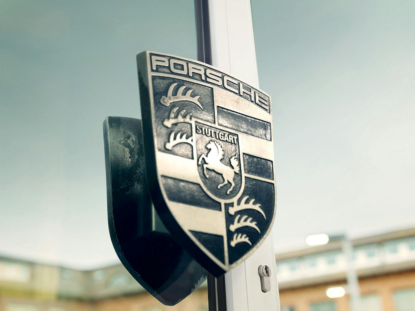 A doorknob in the shape of the Porsche logo.