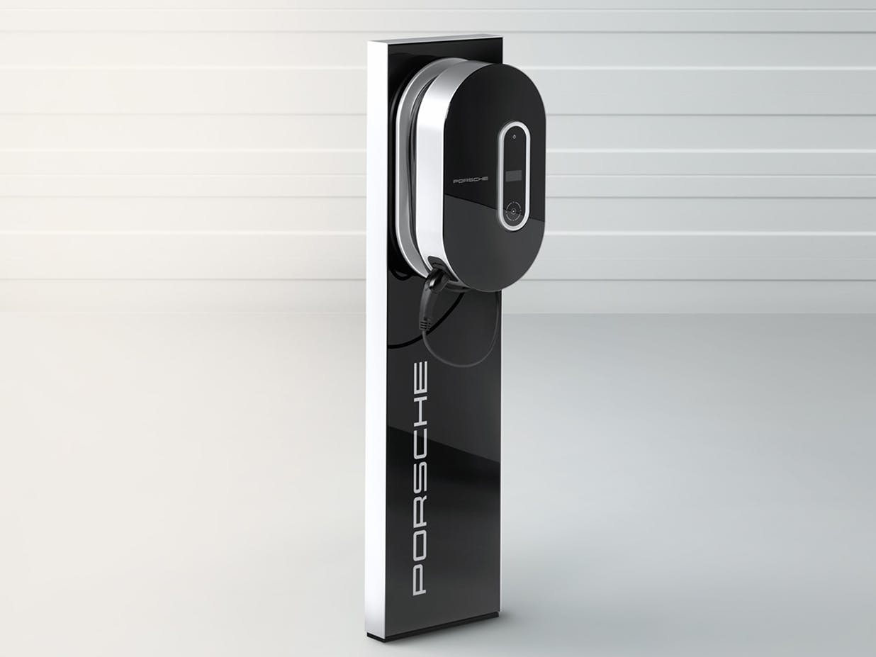Porsche Compact Charging Pedestal against a light grey background.