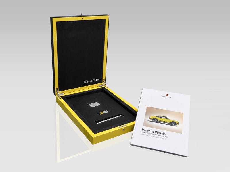 Photo of certificate with badge in a box.