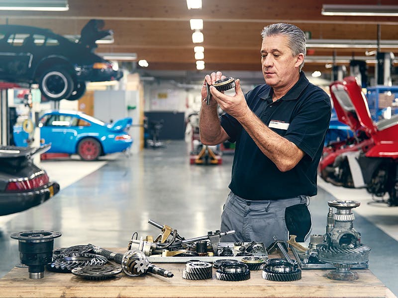 Mechanic checking an engine.