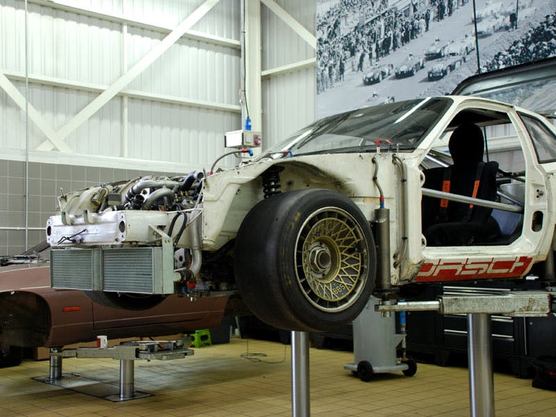 The vehicle divided into key sections stands on a lifting platform.
