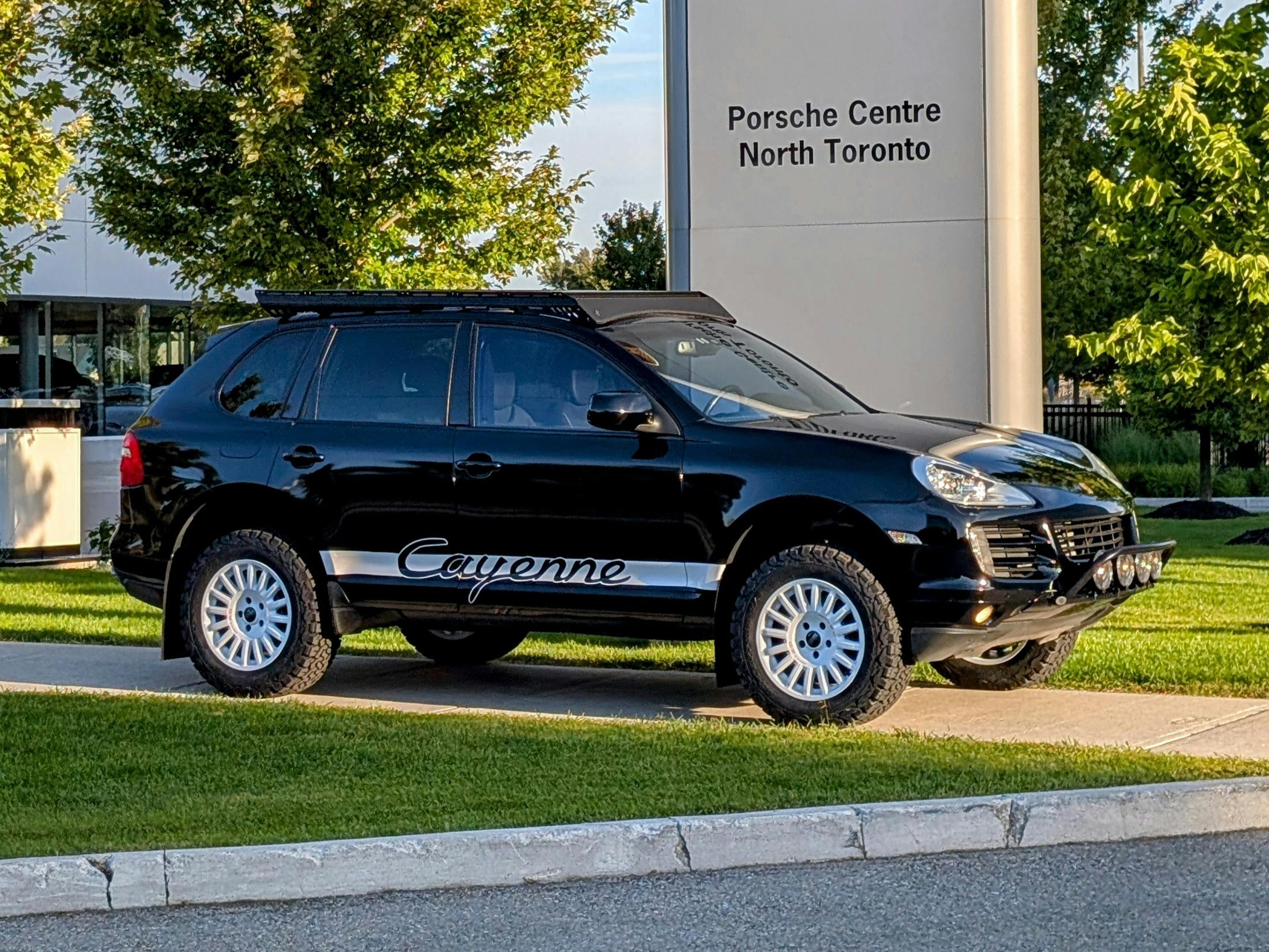 North Toronto – A silver Porsche Cayenne parked on a cobblestone lot.