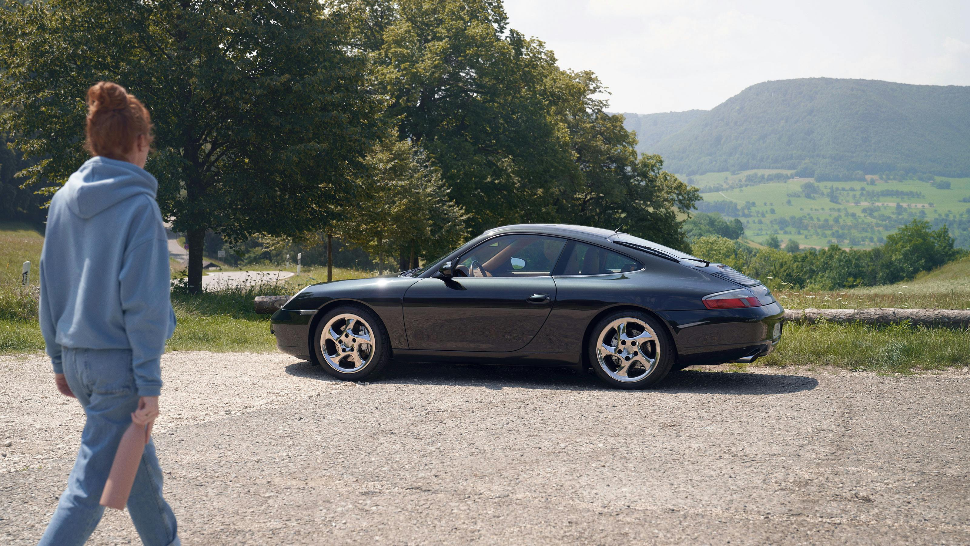 Porsche 911 (Type 996) Coupé, Black, side view.