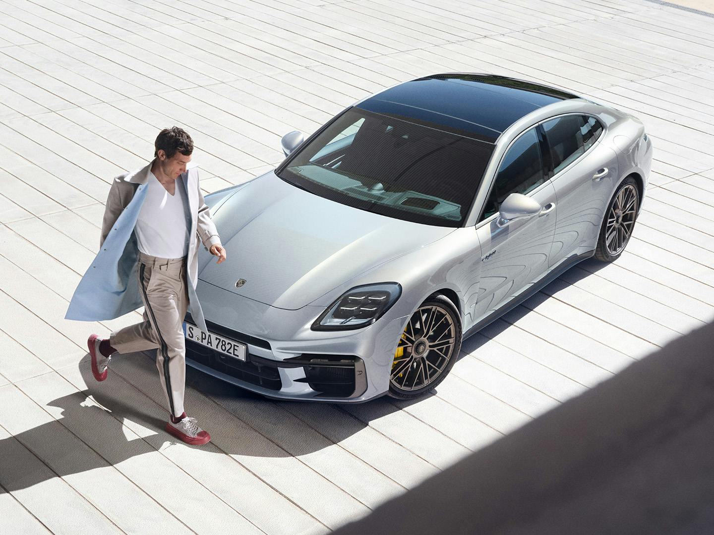 Man walking away from the Panamera Turbo S E-Hybrid.