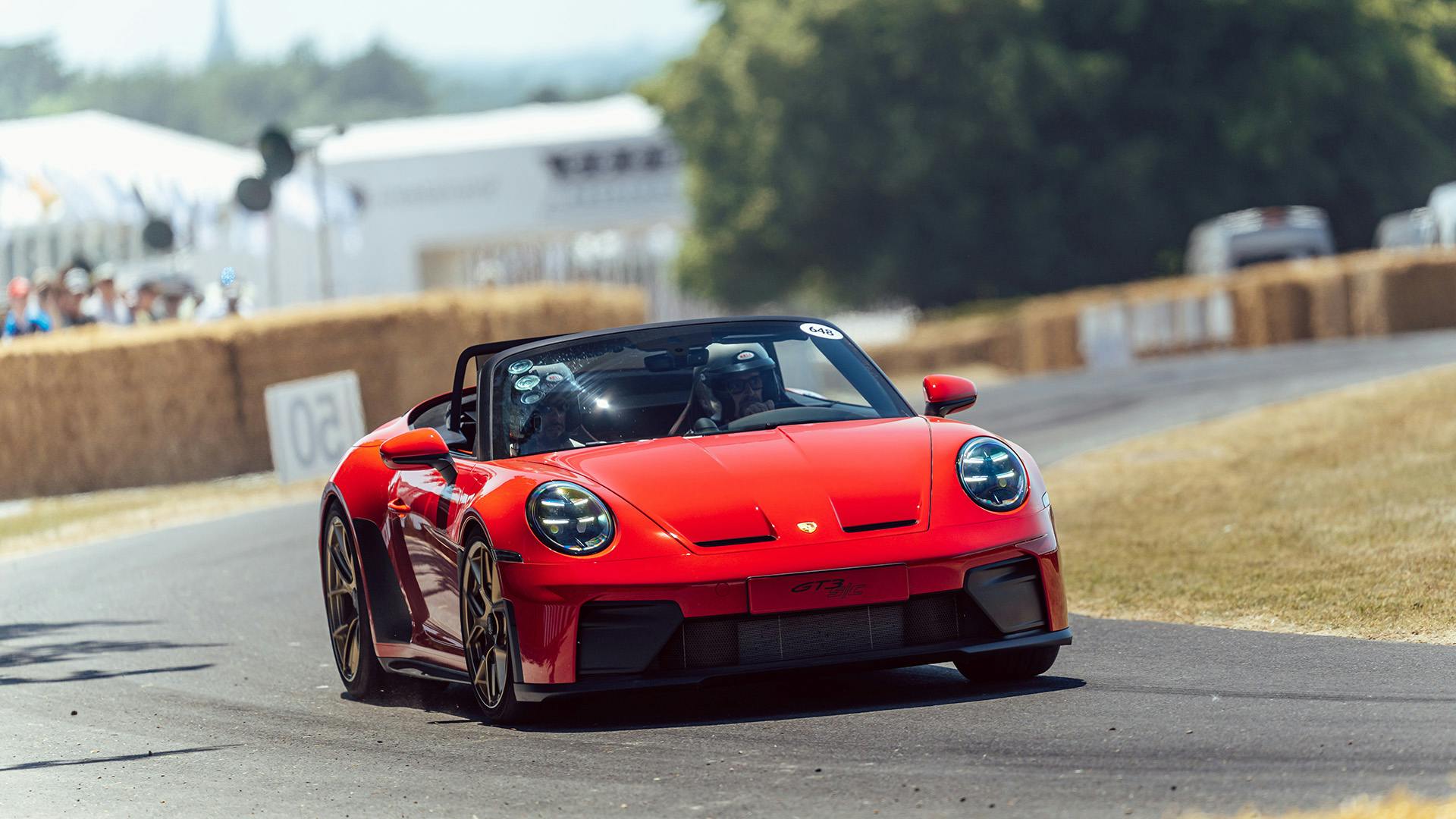 Porsche driving the Goodwood hillclimb.