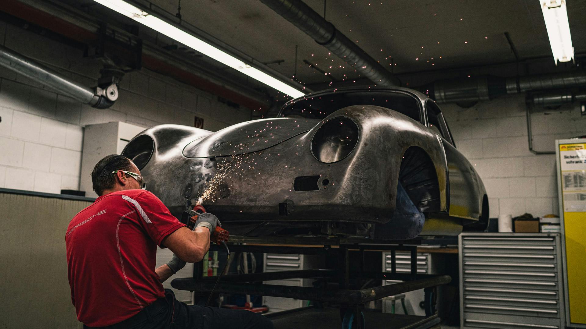 Factory restoration: Mechanic working on a bodyshell.