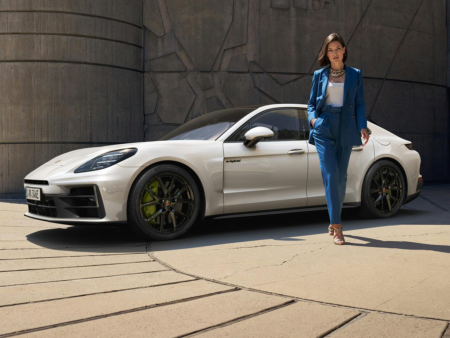 A female walking away from the Panamera 4 E-Hybrid.