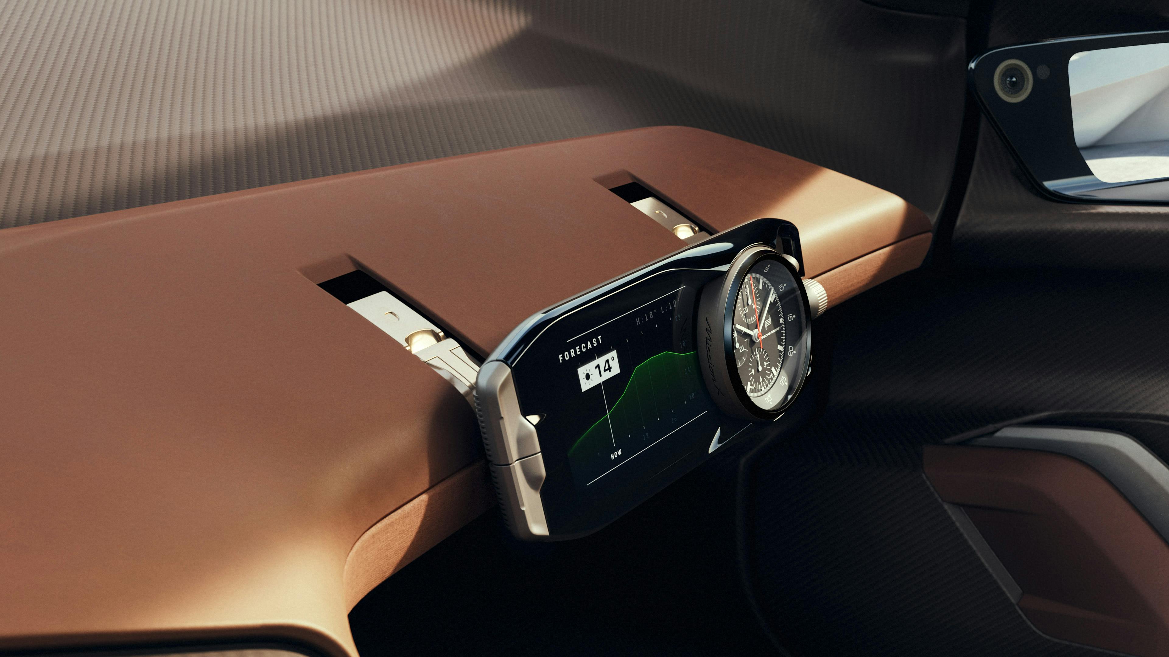 Habitacle de la Porsche Mission X : vue détaillée du module horloger du siège passager avec chronomètre analogique.