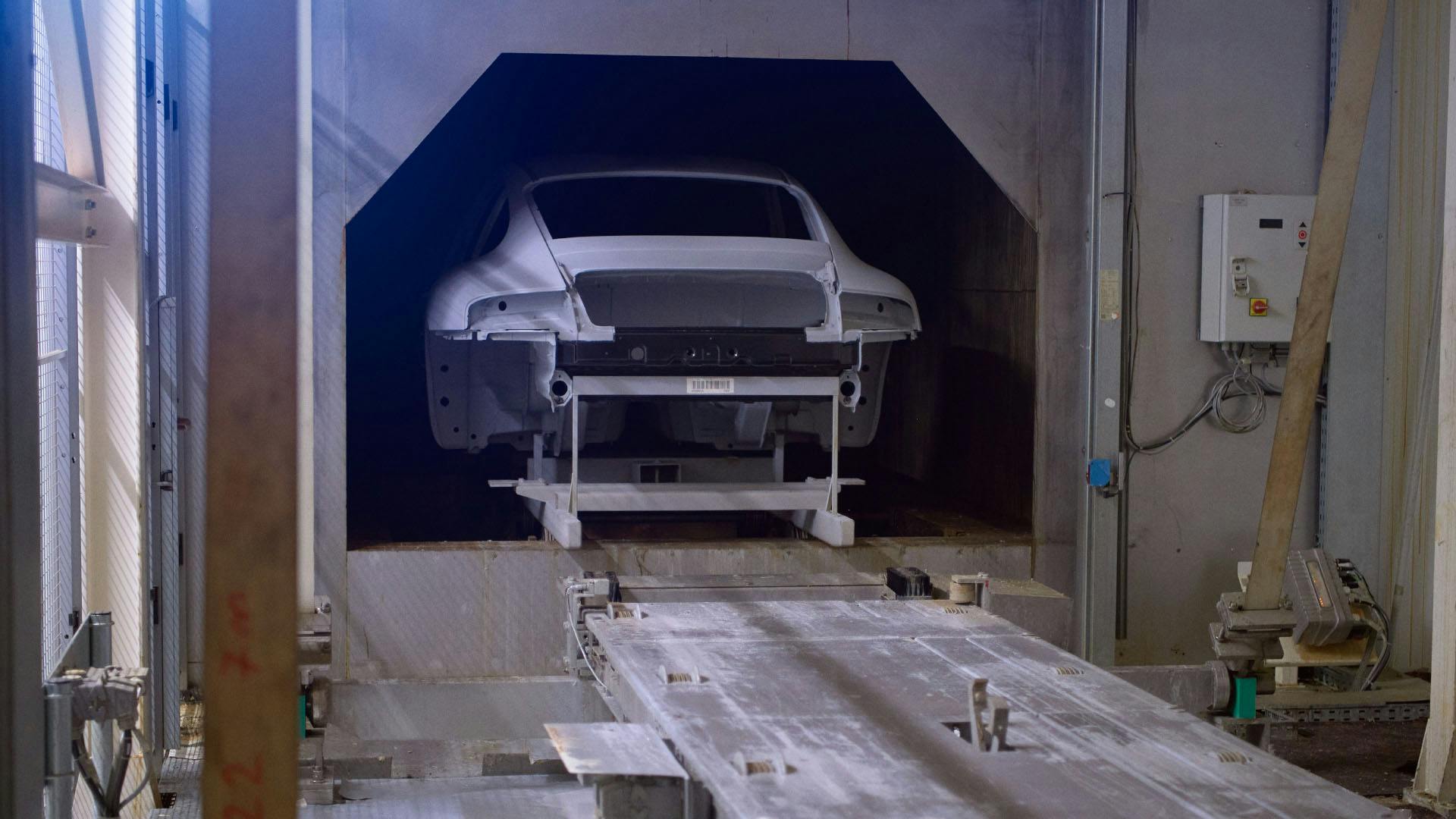 Workshop scene: Porsche bodyshell from behind