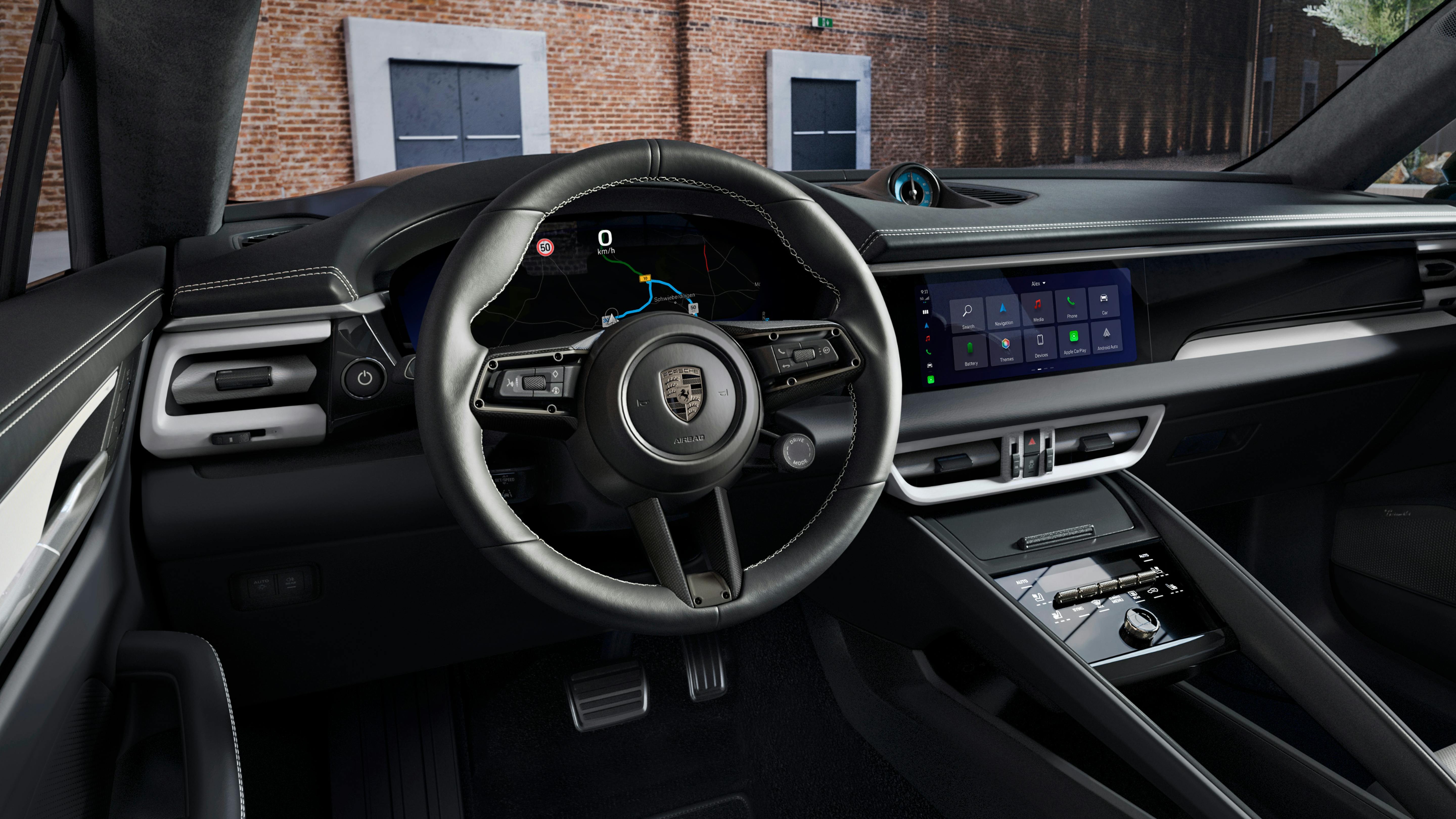 View into the cockpit of the Porsche Exclusive Manufaktur Macan Turbo with Sport Chrono Package in Arctic Blue.