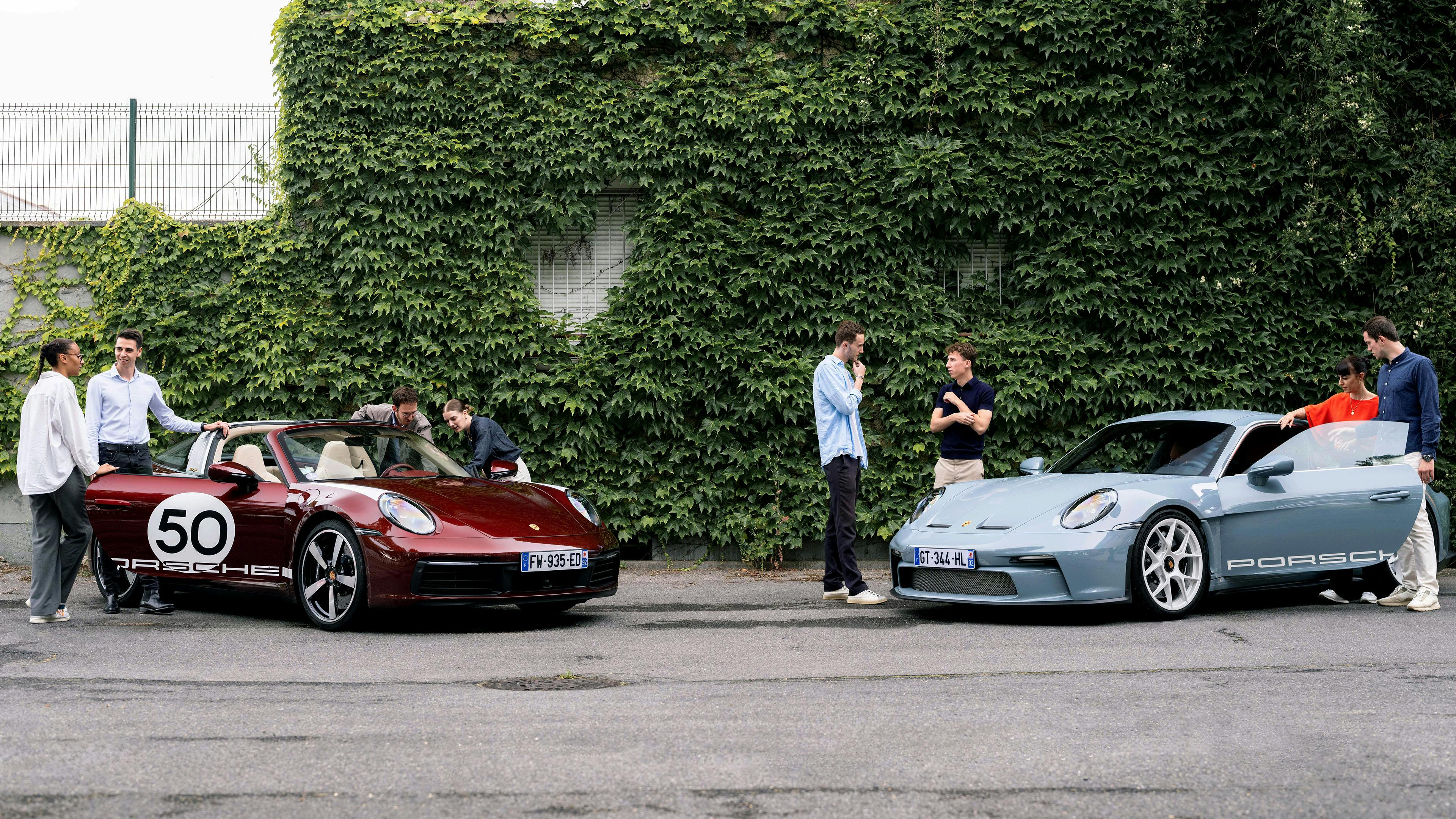 Employees around cars.