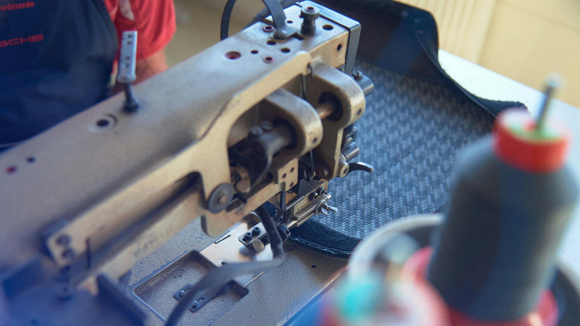 Sewing machine with leather piece with Pepita pattern