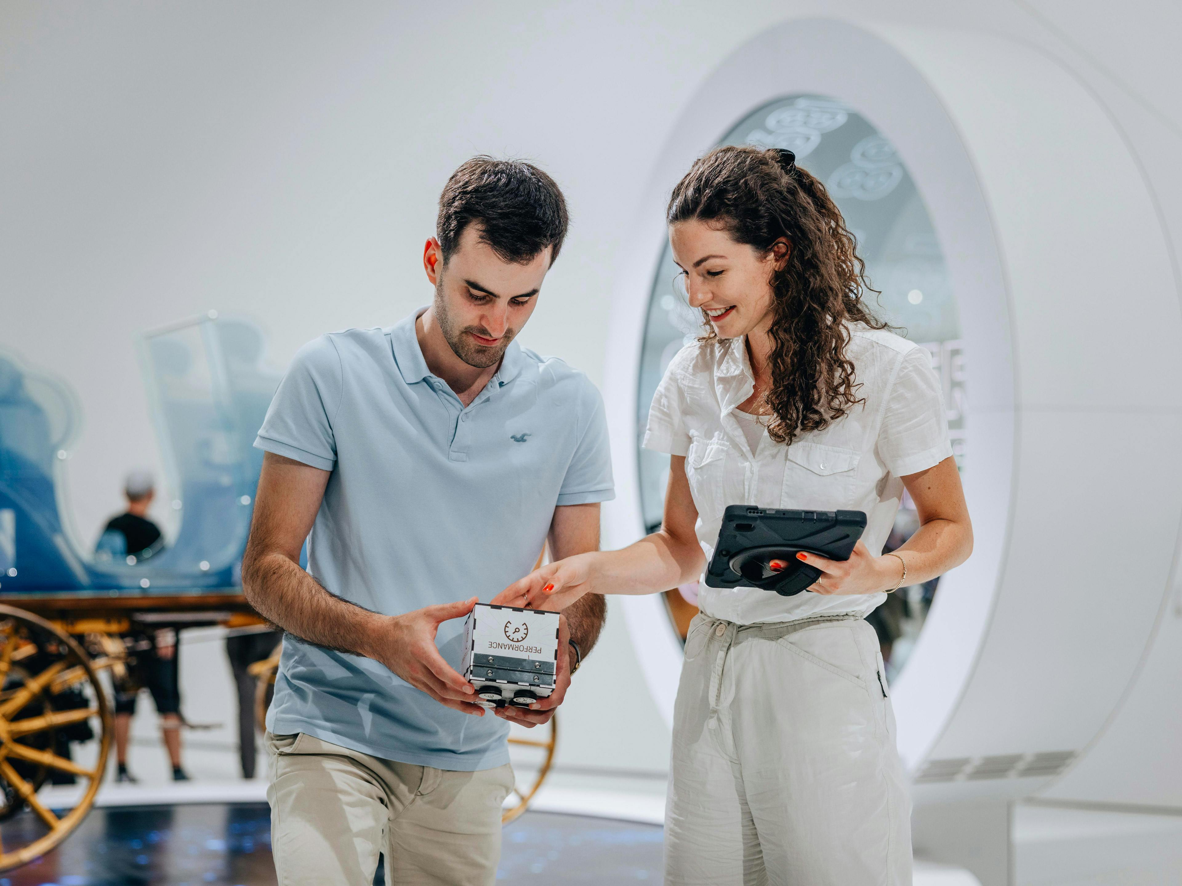 Two people have fun solving the puzzles of the escape game.