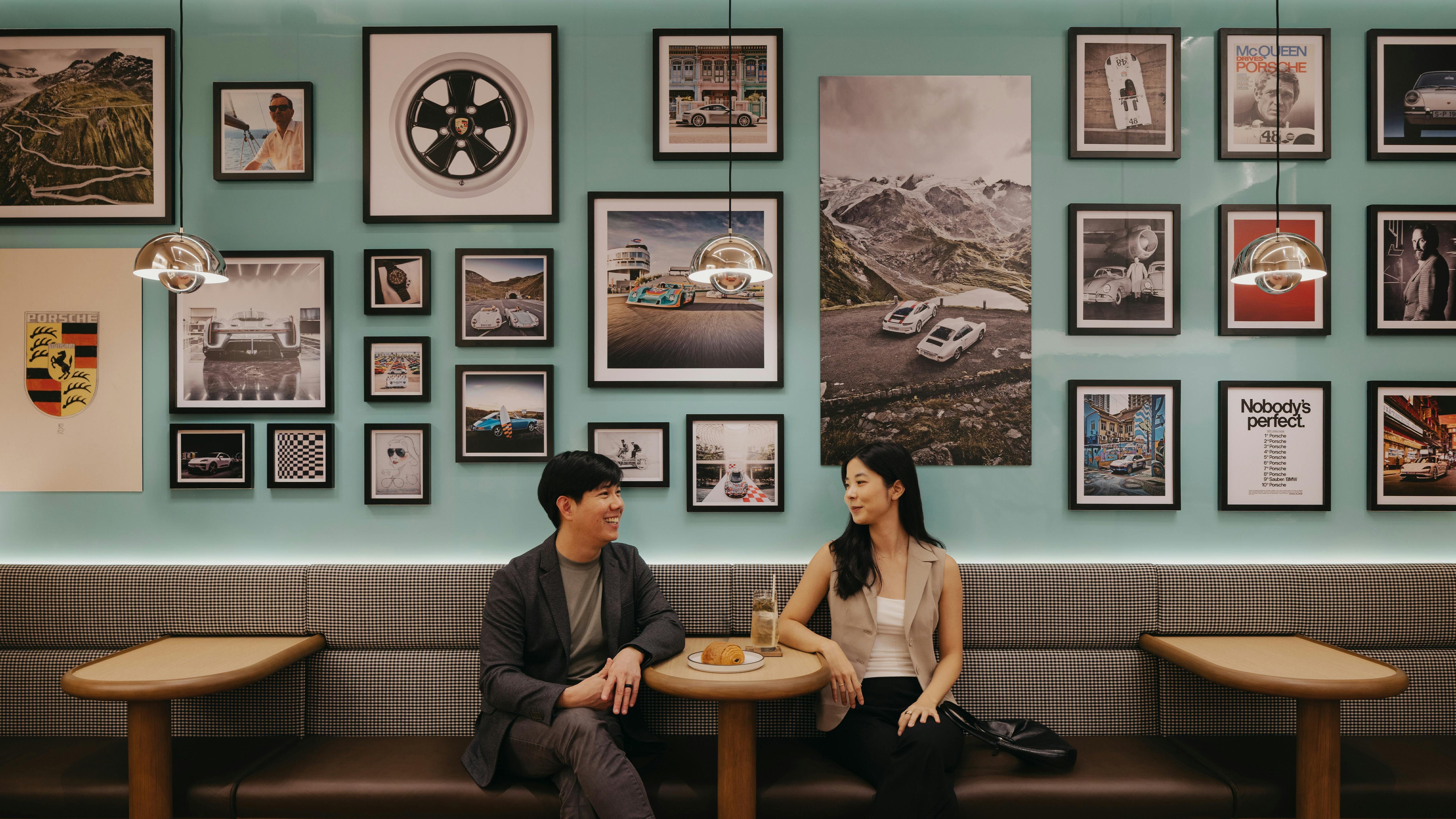 Couple within cafe seating against the Mint Green feature wall by Stefan Bogner