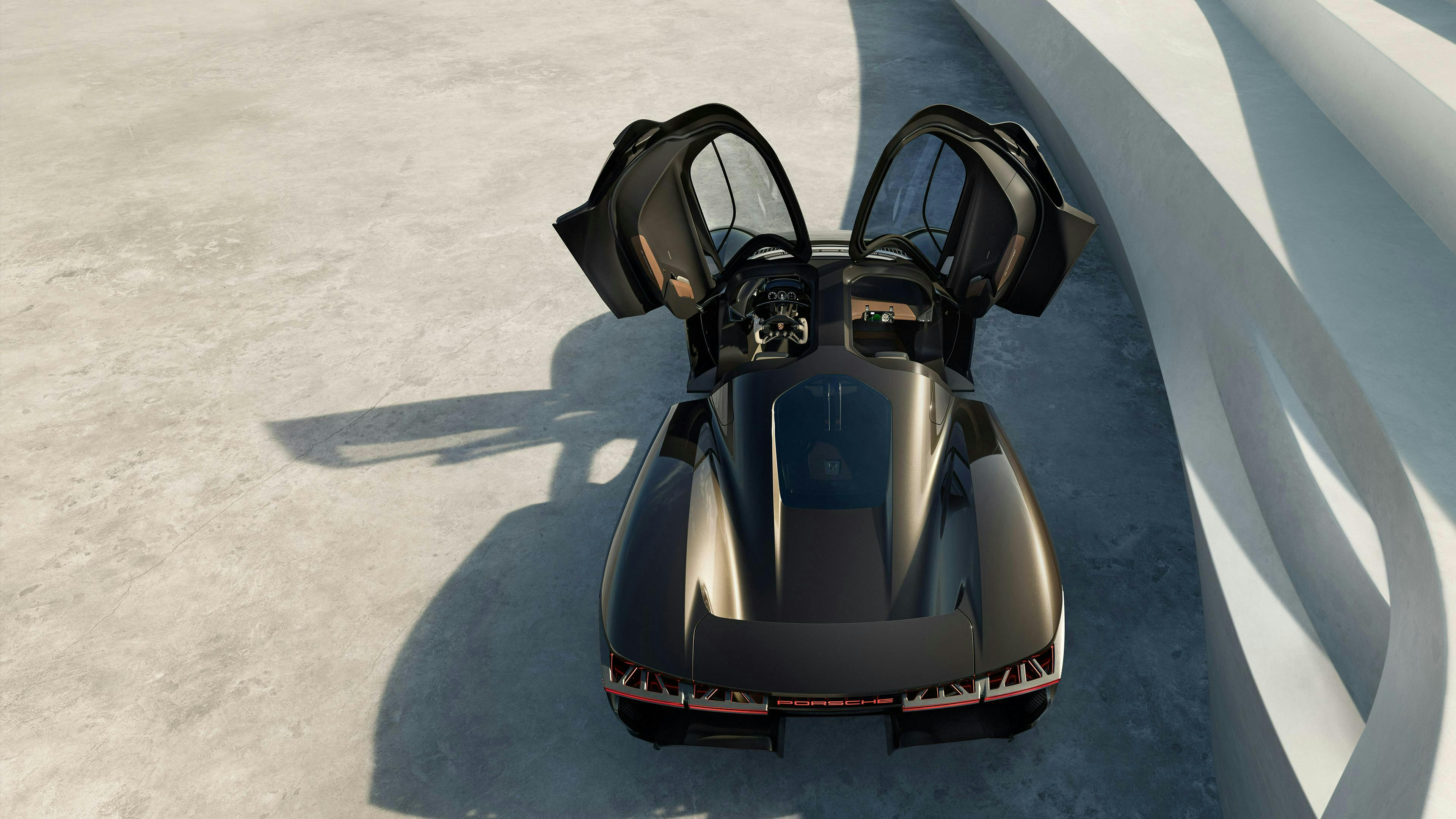 ロケットメタリックのPorsche Mission X ル・マンドアが開かれた車両コンセプトを上から見たビュー
