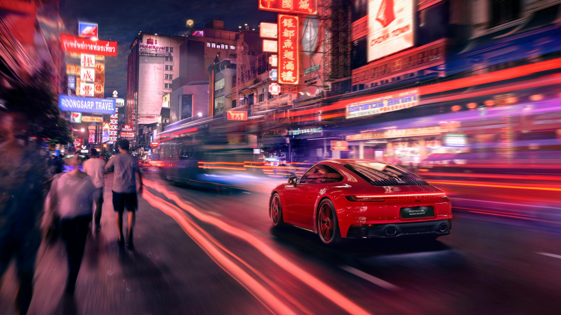 Dreams in Colours: Firered 911 model drives through Thailands streets at night with red-violet neon lights.