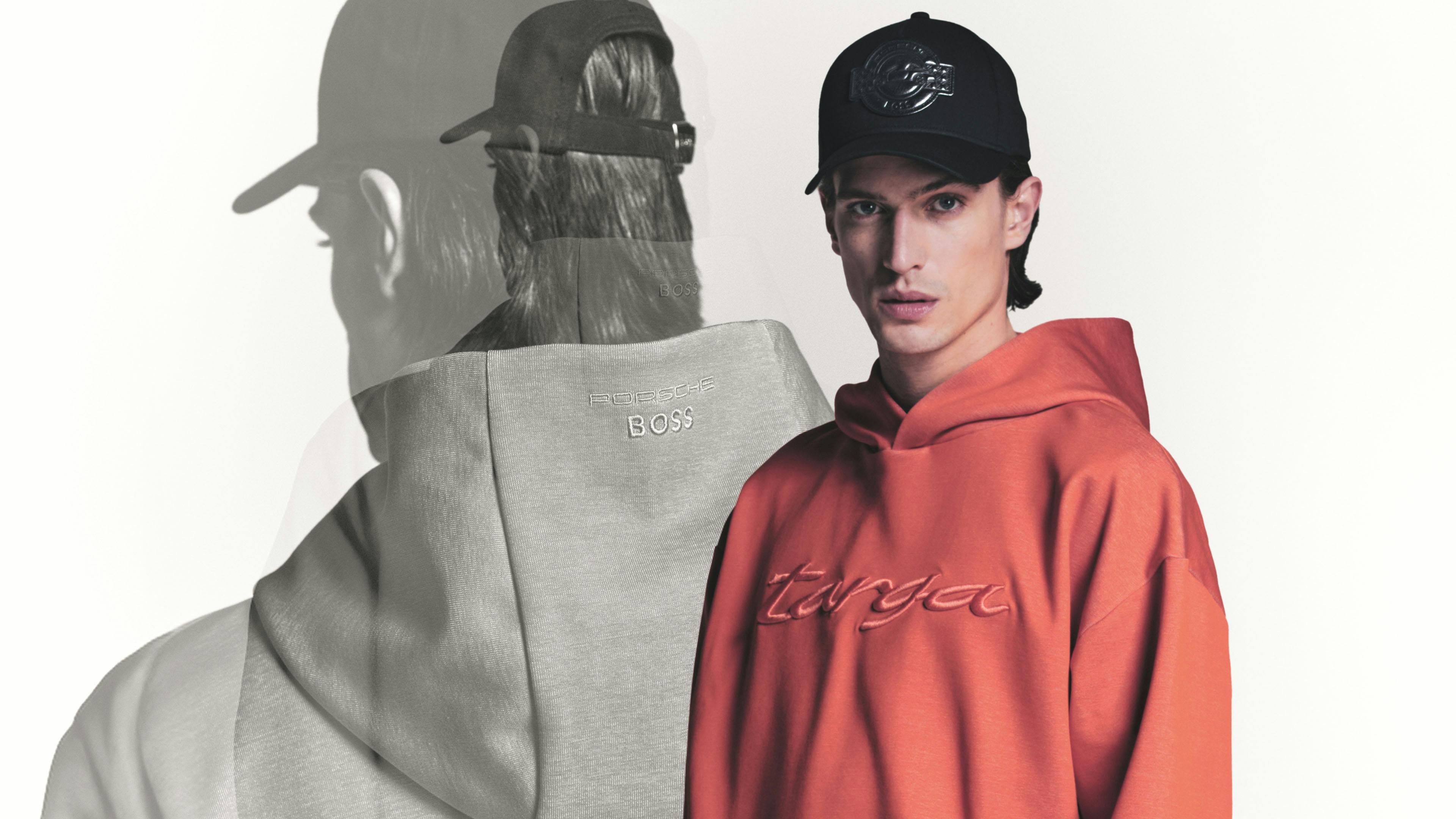 Person dressed in red Targa hoodie and a black cap, with a backview of his silhouette on the left