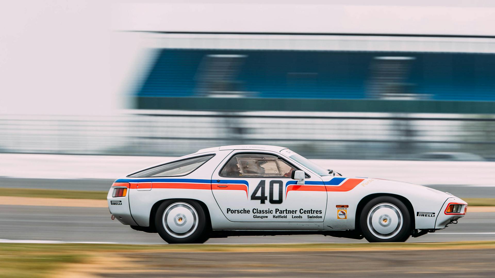 The Porsche 928 racing along the race track.