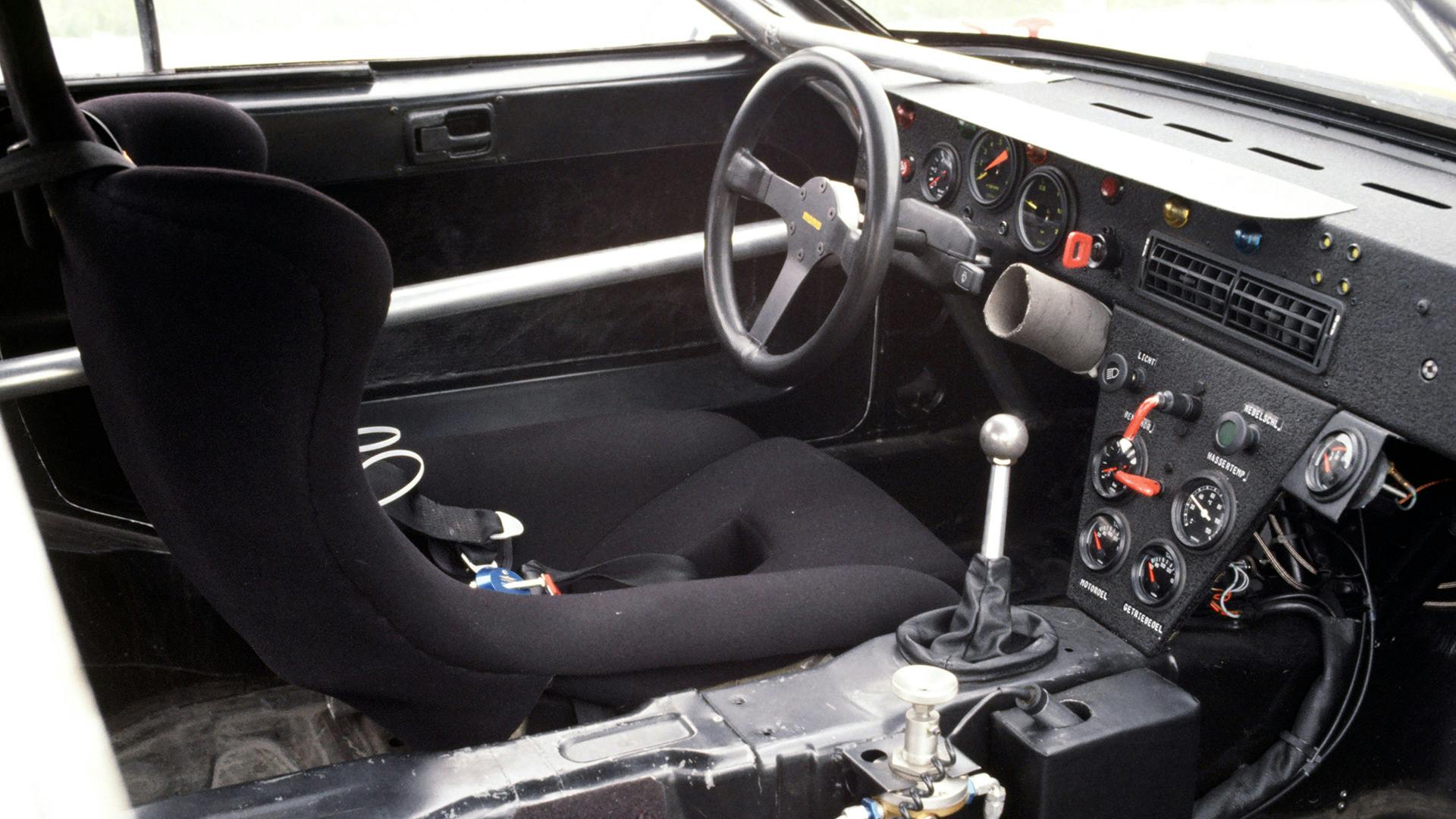 Interior of a Porsche 924 GTP with steering wheel, gear lever and instruments.