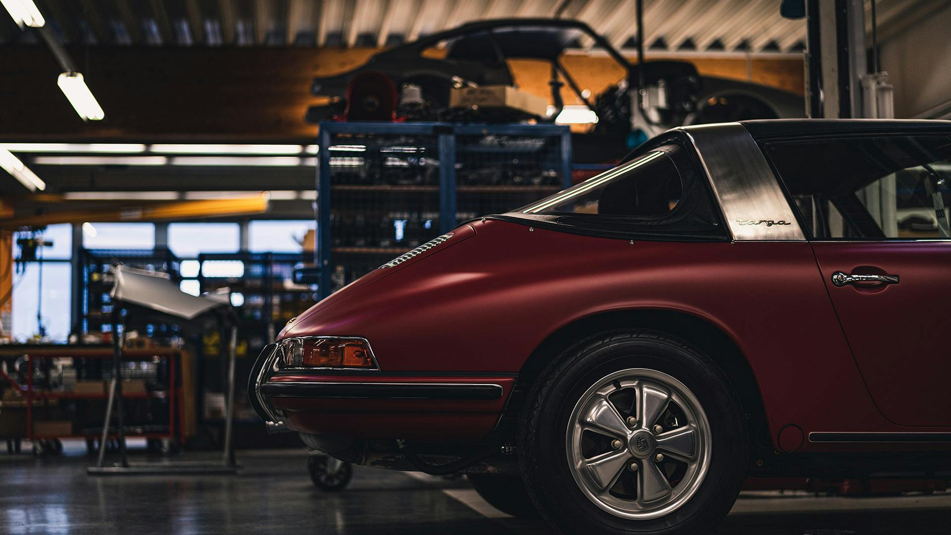 Extract: Burgundy vintage Porsche model.
