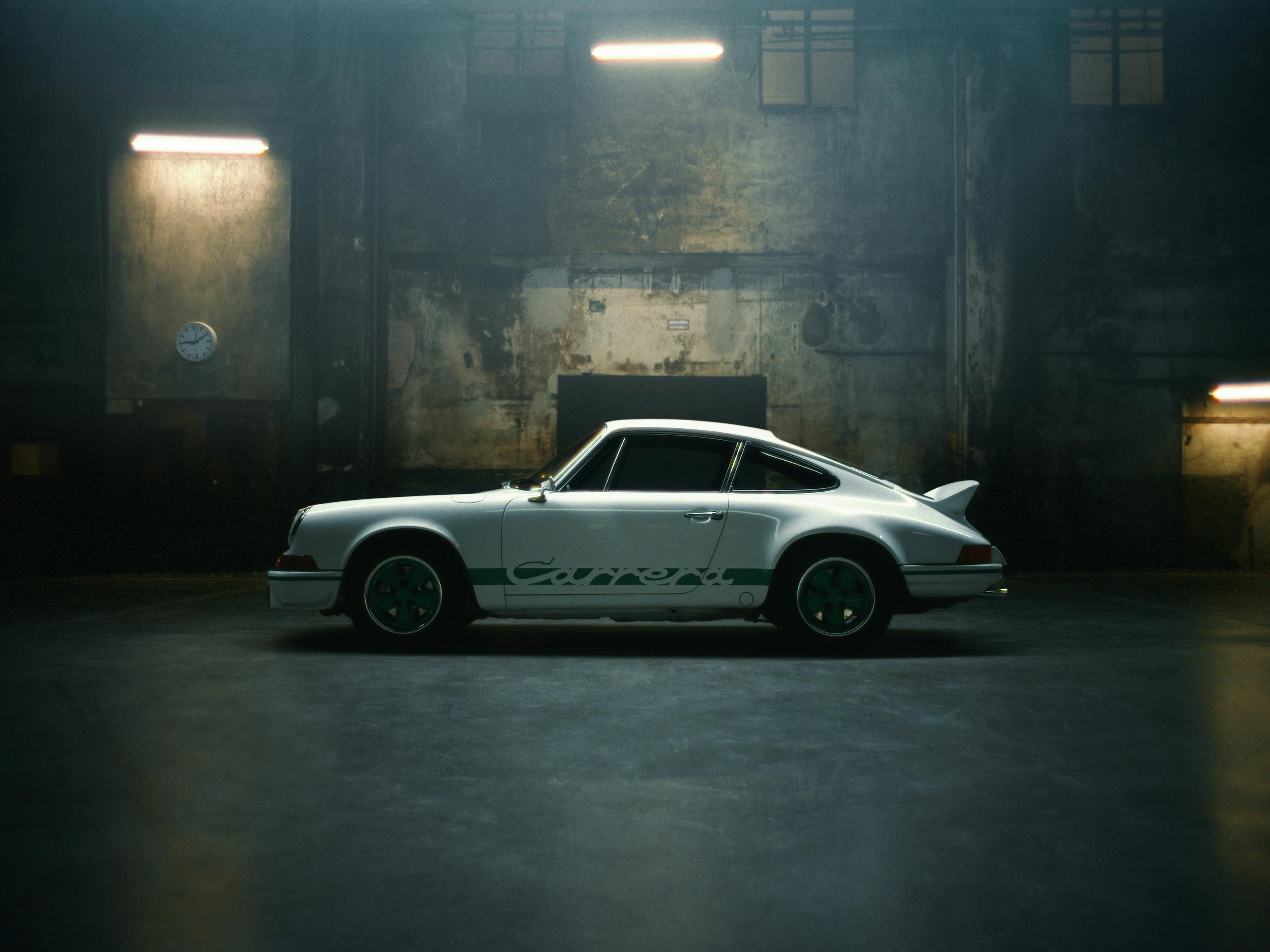 911 Carrera RS 2.7 with Carrera livery in an industrial environment.